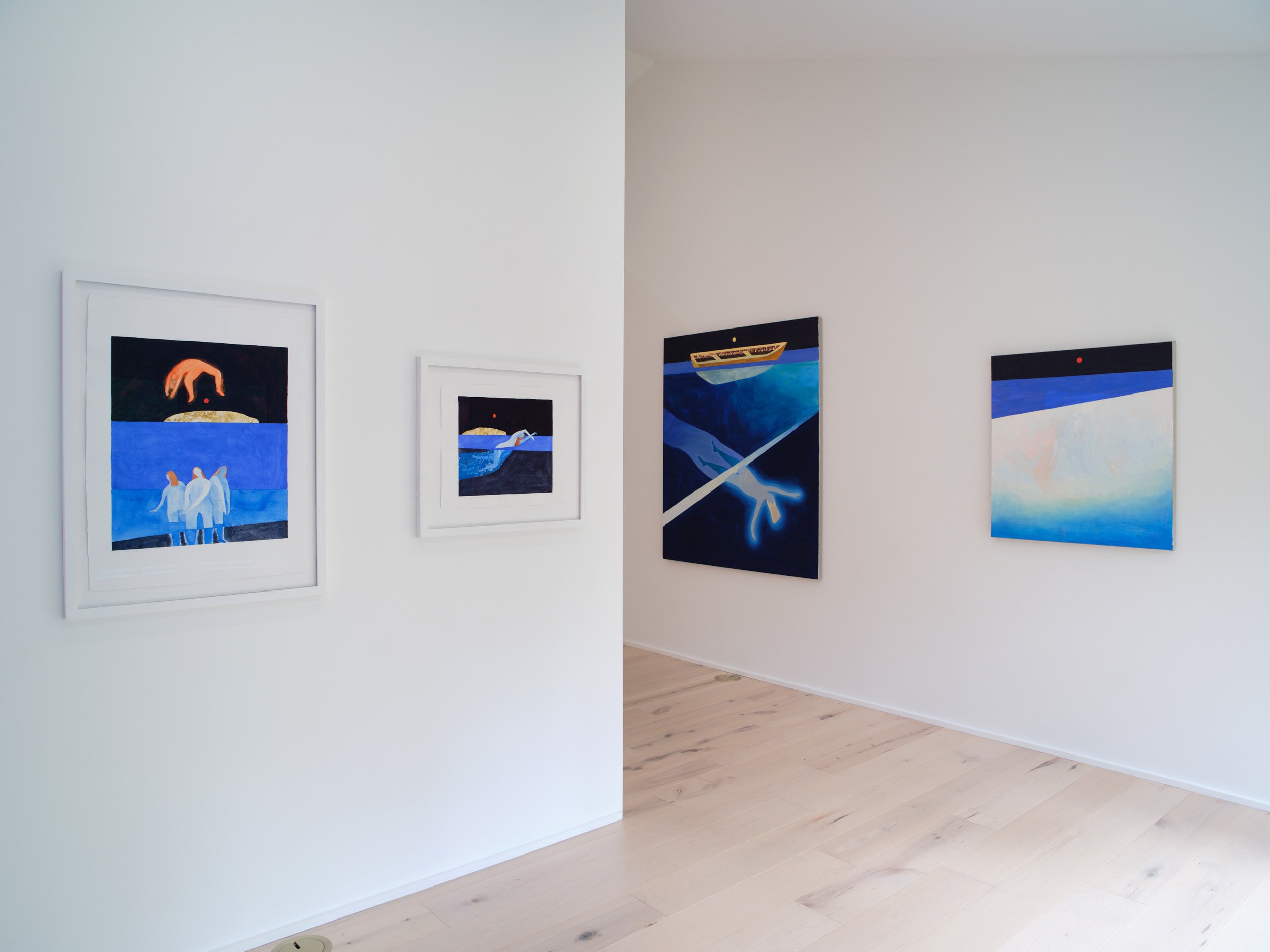 Art gallery wall displaying colorful paintings in a well-lit room with light wooden flooring