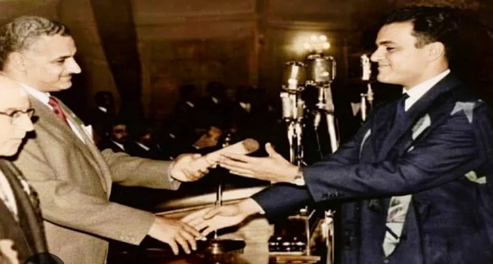 Sir Magdi Yacoub, receiving the Excellence Award from President Gamal Abdel Nasser during the Science Day celebration 1957.
