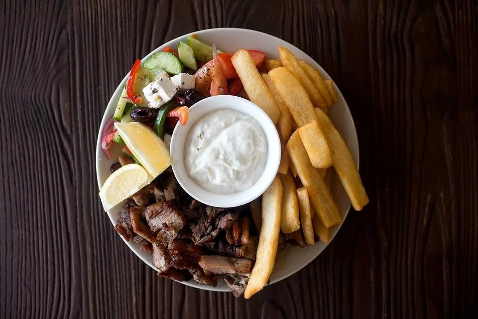 Charcoal Pit Findon's Yiros Plate for One features tender charcoal‑grilled meat, fresh salad, and chips, a classic Adelaide favourite made fresh at Charcoal Pit Findon.