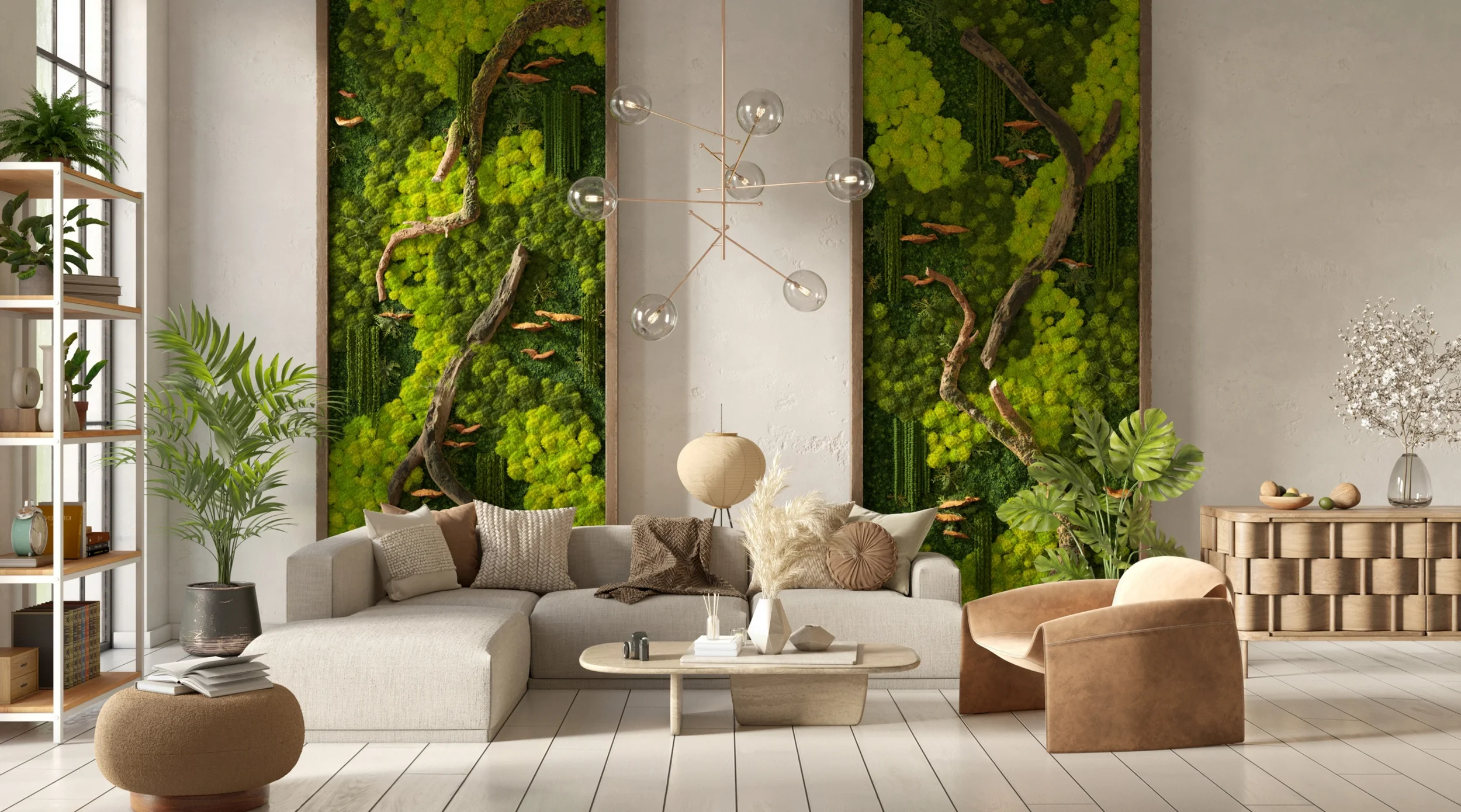 Living room with a large L-shaped sofa, decorative pillows, a wooden side table with a vase, a beige armchair, and lush green plants. Features wall art of green moss and driftwood, modern chandelier, and a bookshelf with books and plants.