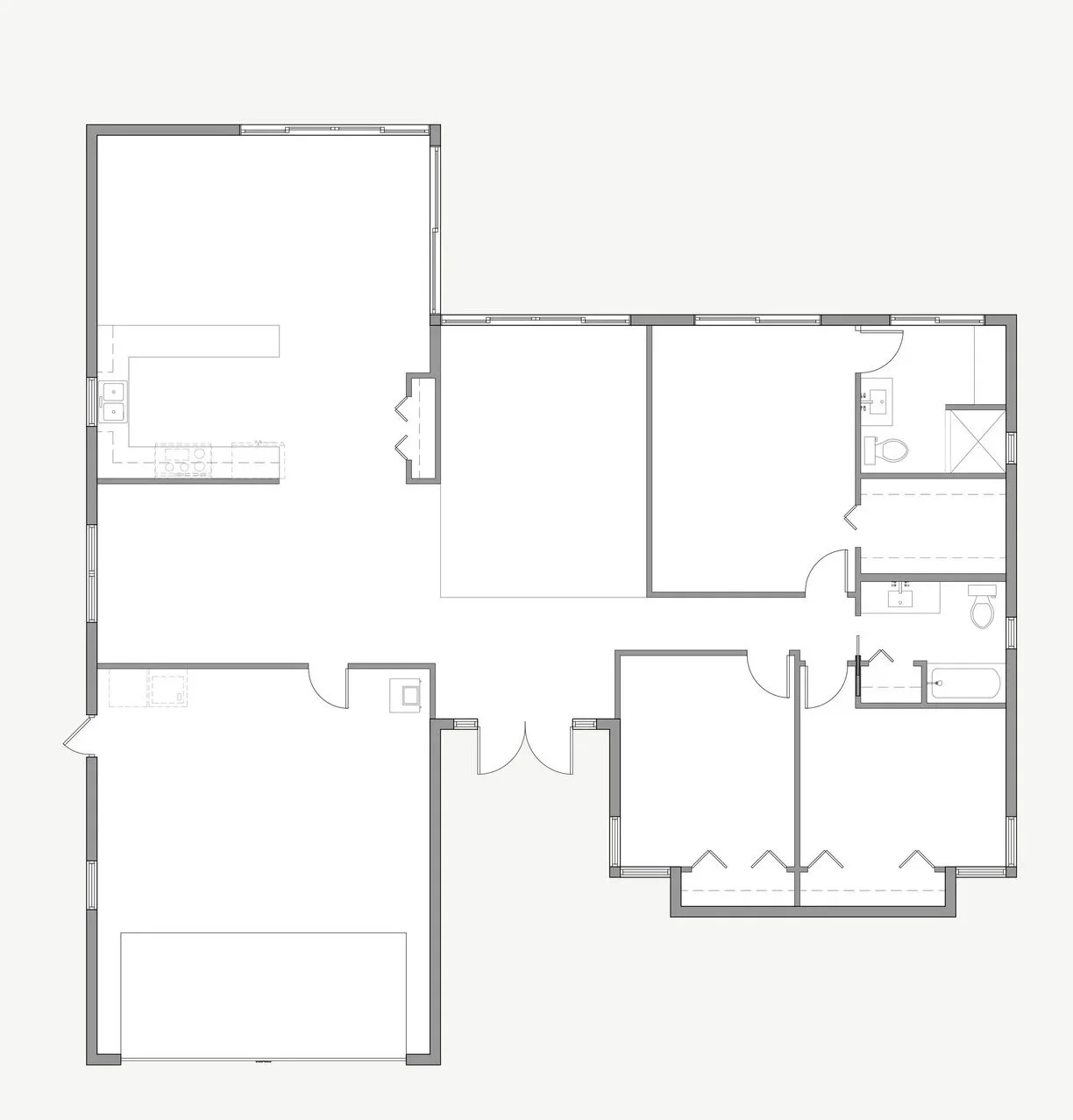 Floor plan of a house showing a kitchen, living areas, bedrooms, and bathrooms.