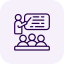 Icon of three people sitting at a table or desk with a laptop, indicating a meeting or collaborative work.