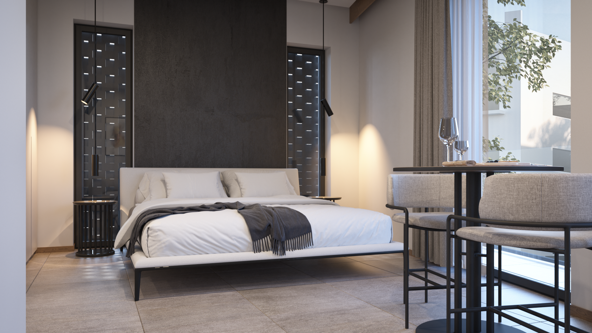 Modern bedroom with a white bed, black side table, and pendant lights, next to a window with curtains and a small dining area with glasses and chairs.