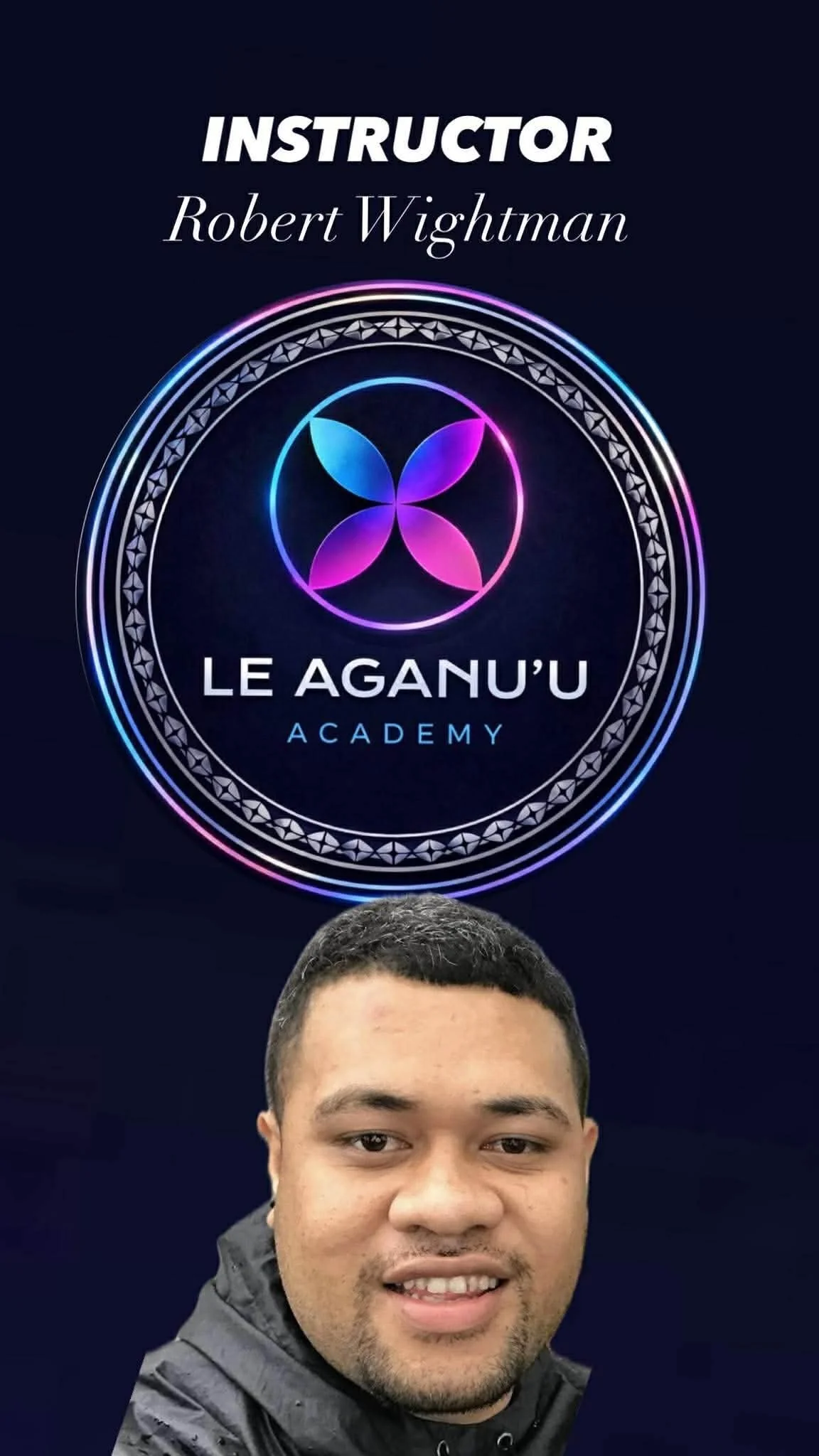 A young man with short dark hair smiling, wearing a black jacket, with a sign behind him that includes the words 'Instructor Robert Wightman' and 'Le Aguan'u Academy' with a colorful circular logo.