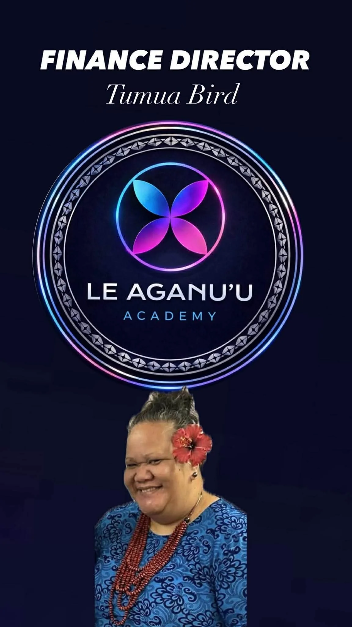 A woman smiling in front of a dark background with a neon logo and text that reads 'Finance Director Tumua Bird' and 'Le Aguan'u Academy.' The woman has facial tattoos, a flower in her hair, and is wearing traditional Polynesian jewelry and a blue patterned dress.