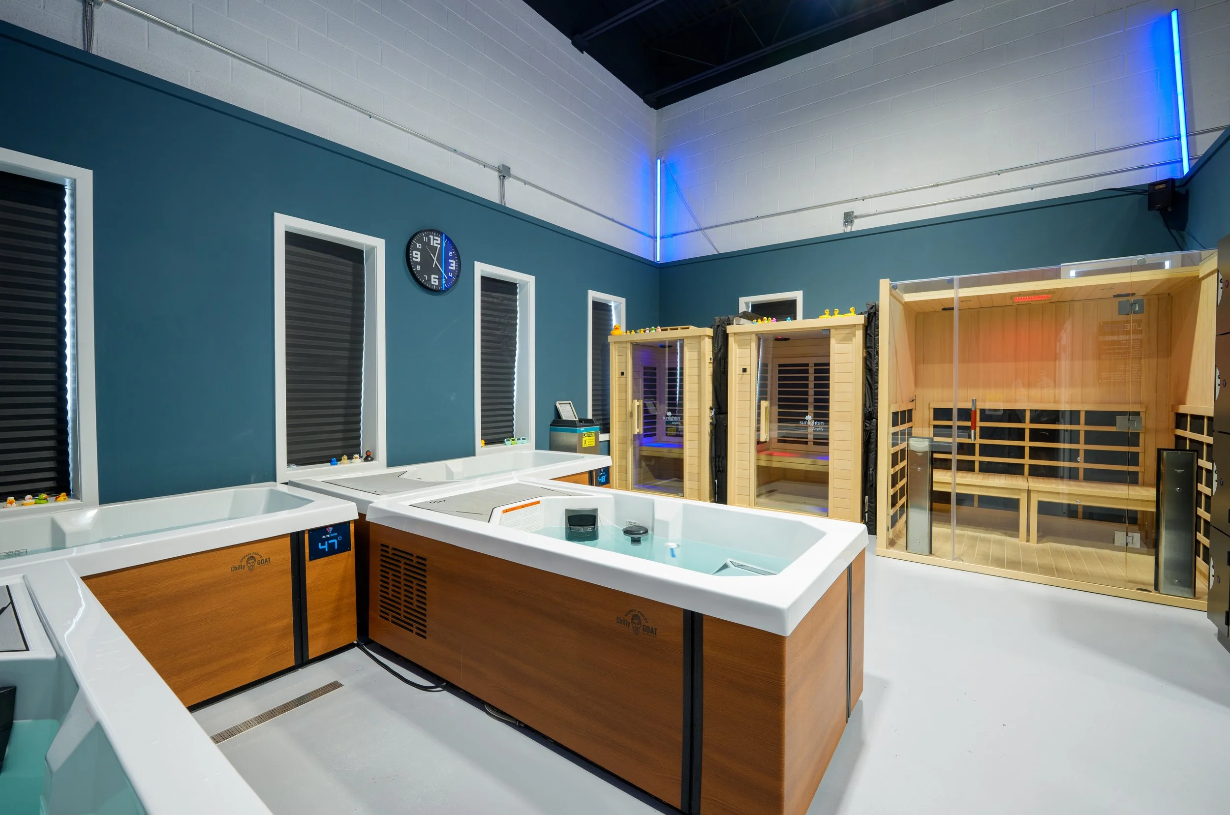 A photo of the back room at Elite Edge Recovery featuring 3 different cold plunges, one hot tub, and 3 infrared saunas located around Malvern, Exton, Downingtown, and West Chester, PA 