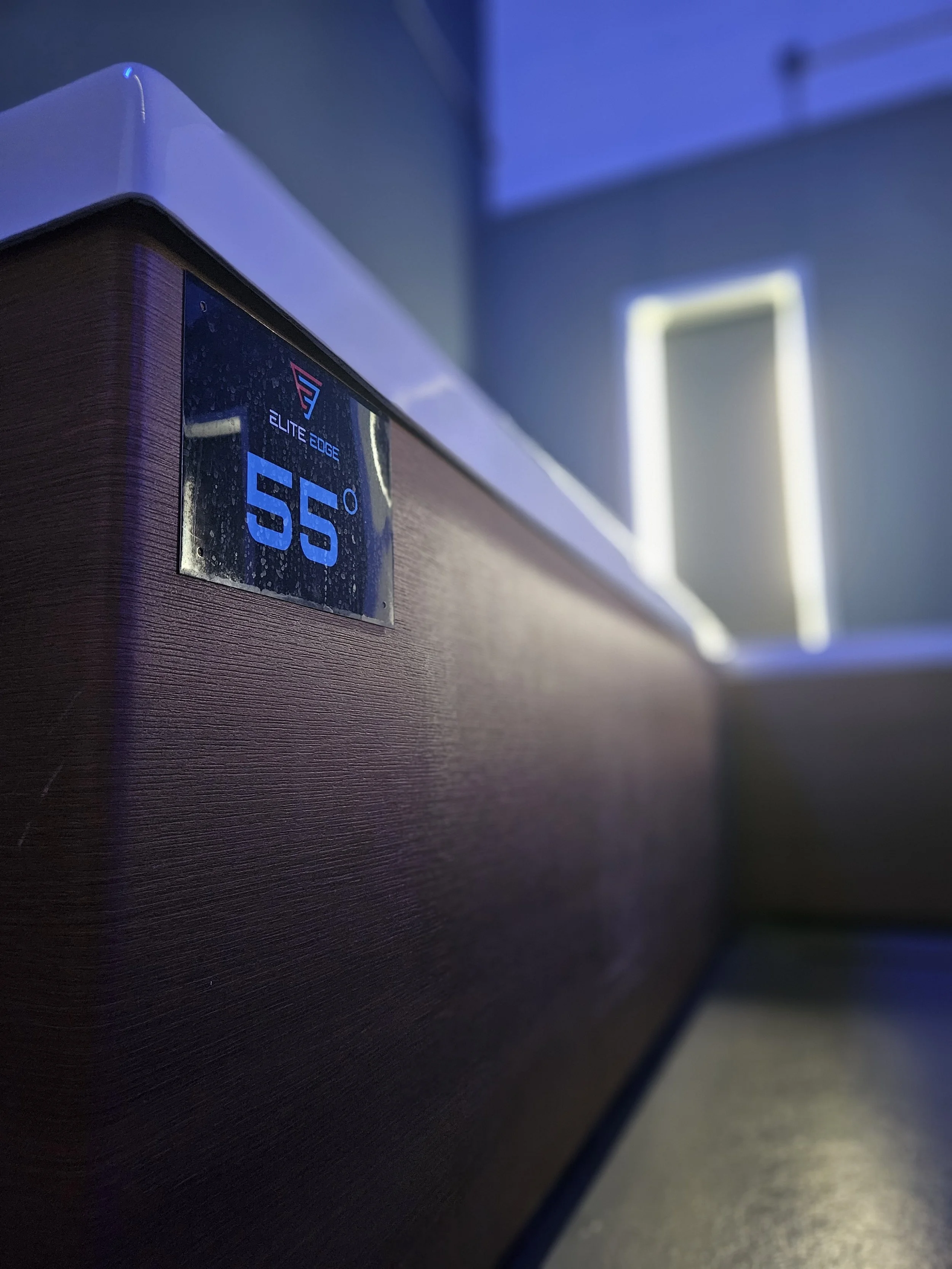 Close-up of a temperature display sign on the side of a Cold Plunge showing a temperature of 55 degrees. located near Downingtown, PA.