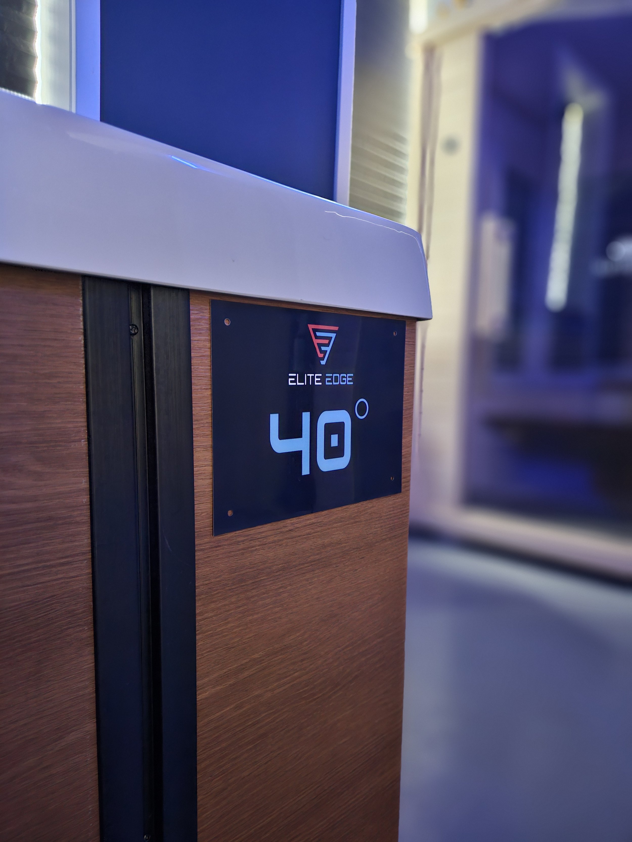 Digital display on a furniture piece showing a temperature of 40 degrees, with the logo 'Elite Edge' above it.
