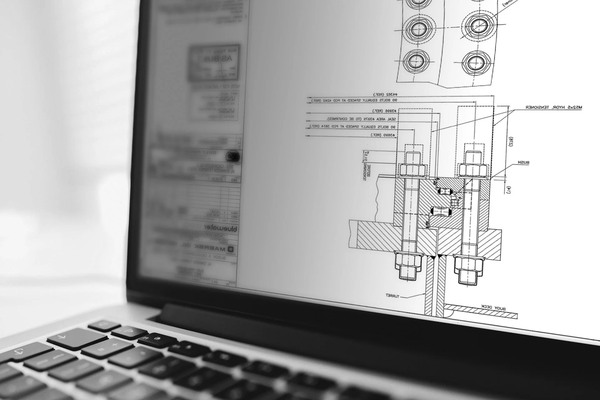 Photo of a technical drawing displayed in the editing window in AutoCAD, showing technical details and notes.