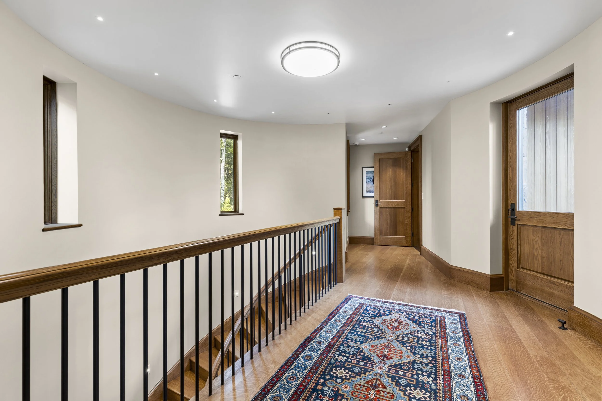 Hall to Primary and stairs to Gym and Hot tub.jpg