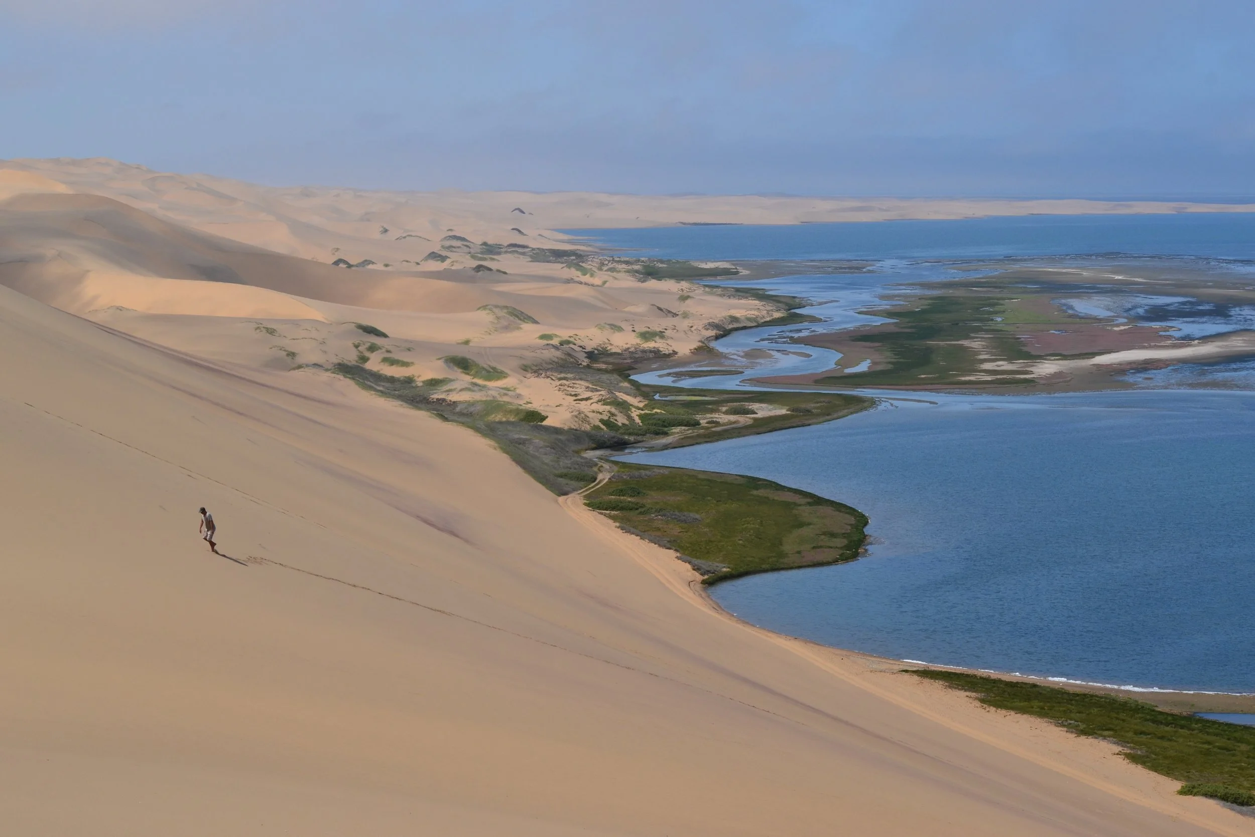 Where the gorgeous white dunes of the Namib Desert meet the Atlantic Ocean, near Walvis Bay, Namibia. Namibia is a truly stunning country. And I say this as someone who generally isn't a fan of the desert. February 2026. 