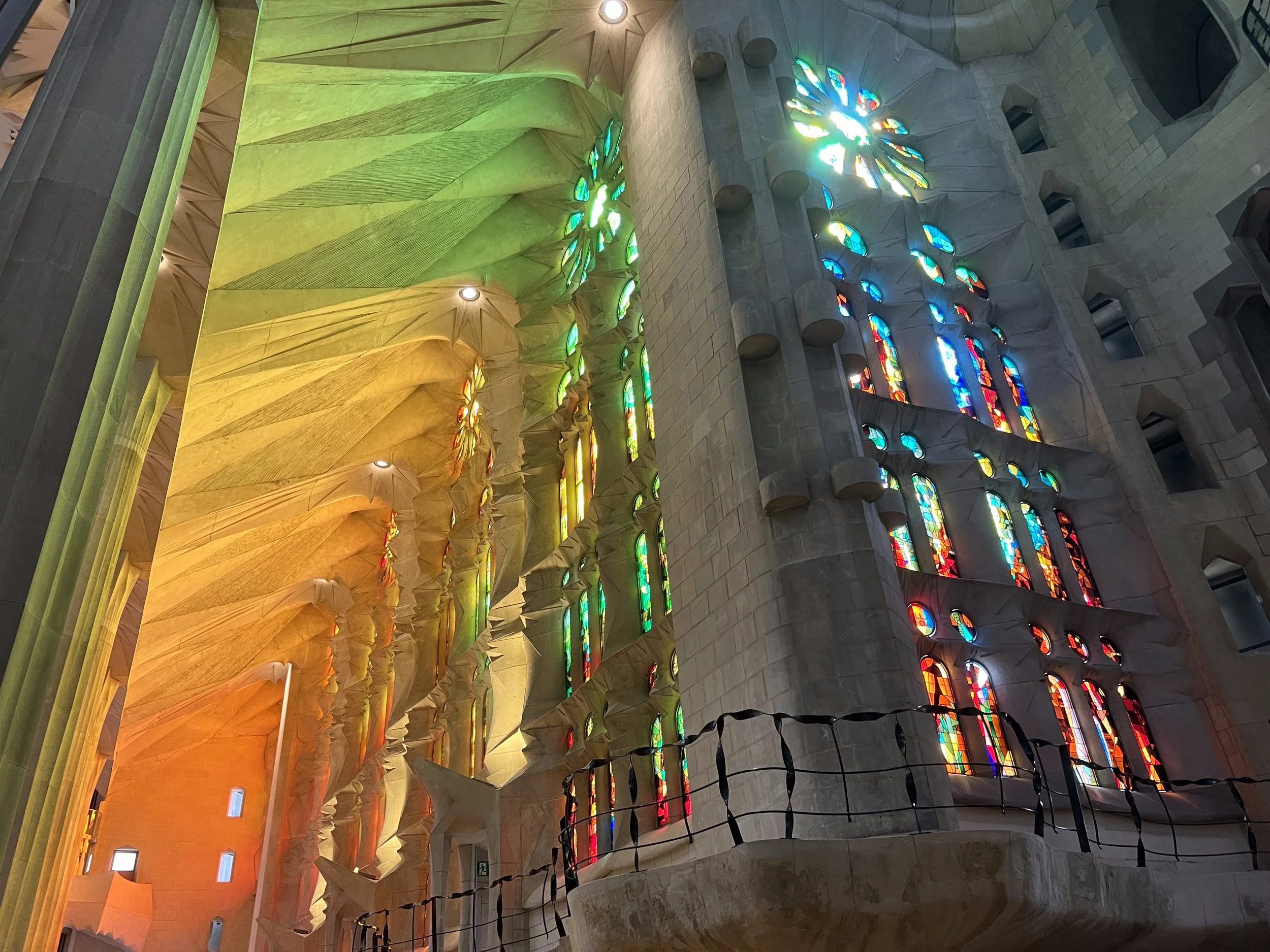 I find the Sagrada Familia in Barcelona, Spain a fascinating basilica. While the light from the stunning stained glass windows in the this Antoni Gaudí-designed church is warm and enveloping, I find the church itself cold because the stone is all mac