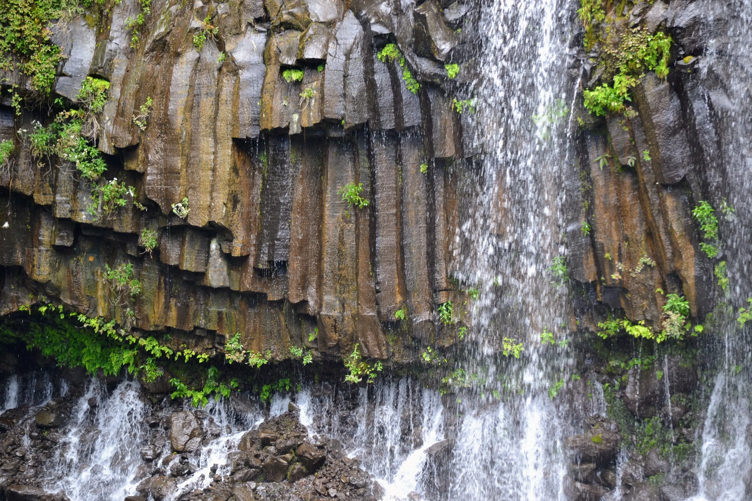 A waterfall on Réunion. Reunion is part of France but it is a small island off the coast of Madagascar in the Indian Ocean. The 11 hour flight between Saint-Denis, Réunion and Paris is the longest domestic flight in the world. November 2022. 
