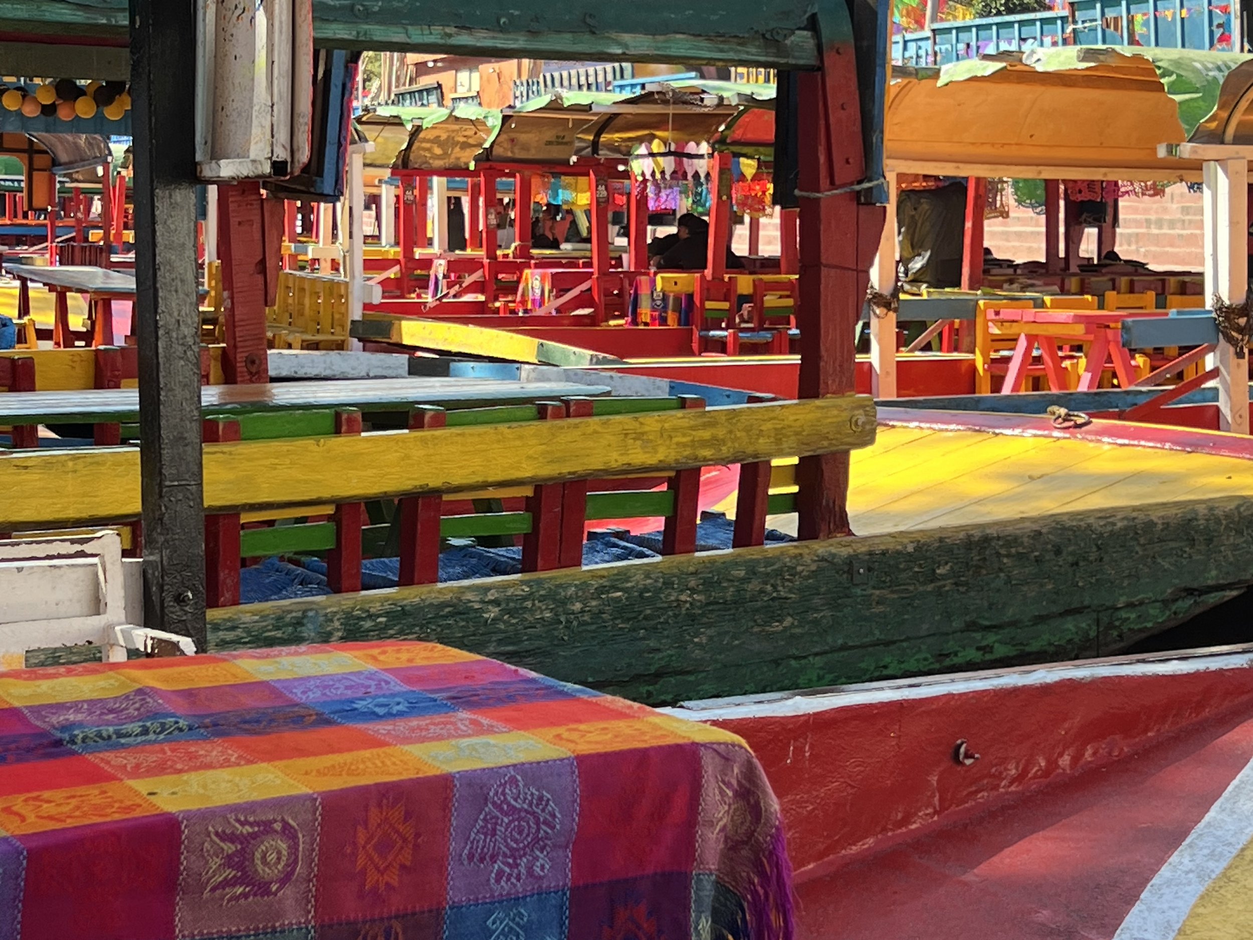 Trajineras, the special kind of boat used to navigate the waters of Xochimilco, outside of Mexico City. November, 2025. 