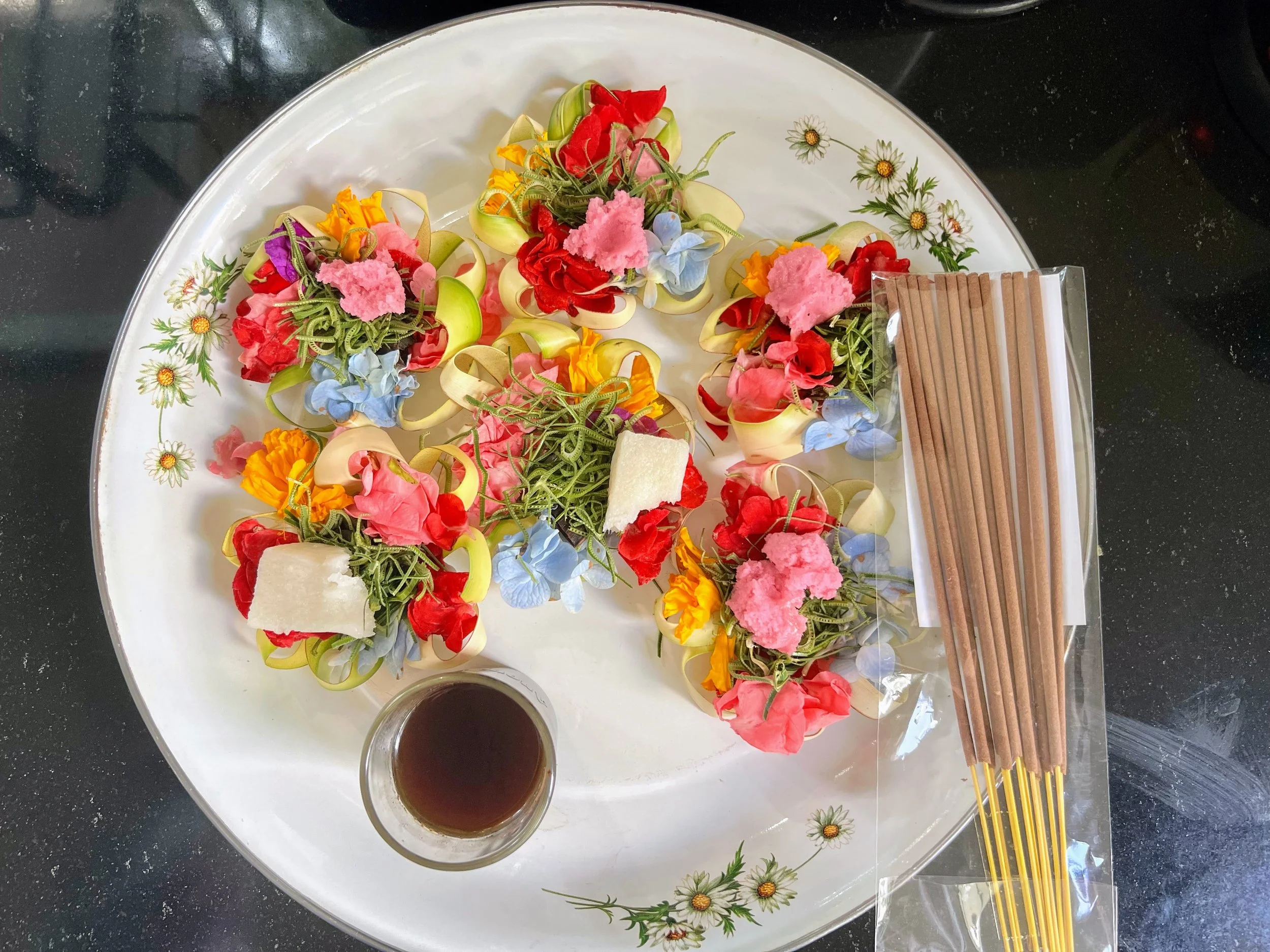 Daily offerings made by our wonderful housekeeper, Dayu, at our rented house in northern Bali, Indonesia. Balinese Hinduism is distinct from other forms of Hinduism. April 2025. 