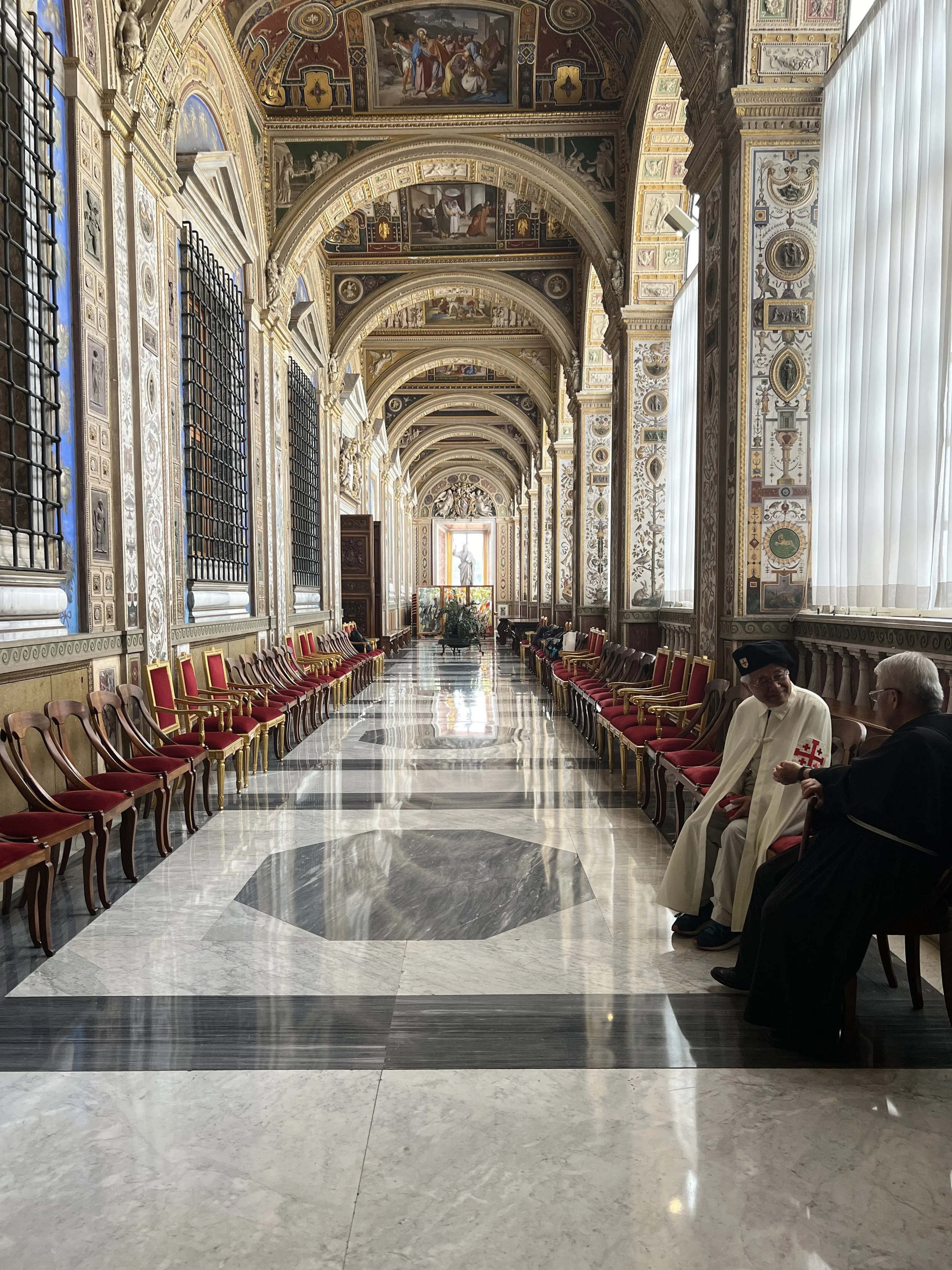These are two priests (though presumably of a higher rank) in a relatively private hallway of The Vatican. My husband participated in a scientific meeting hosted by the Vatican Observatory and as a result, his group (including me!) were invited for a