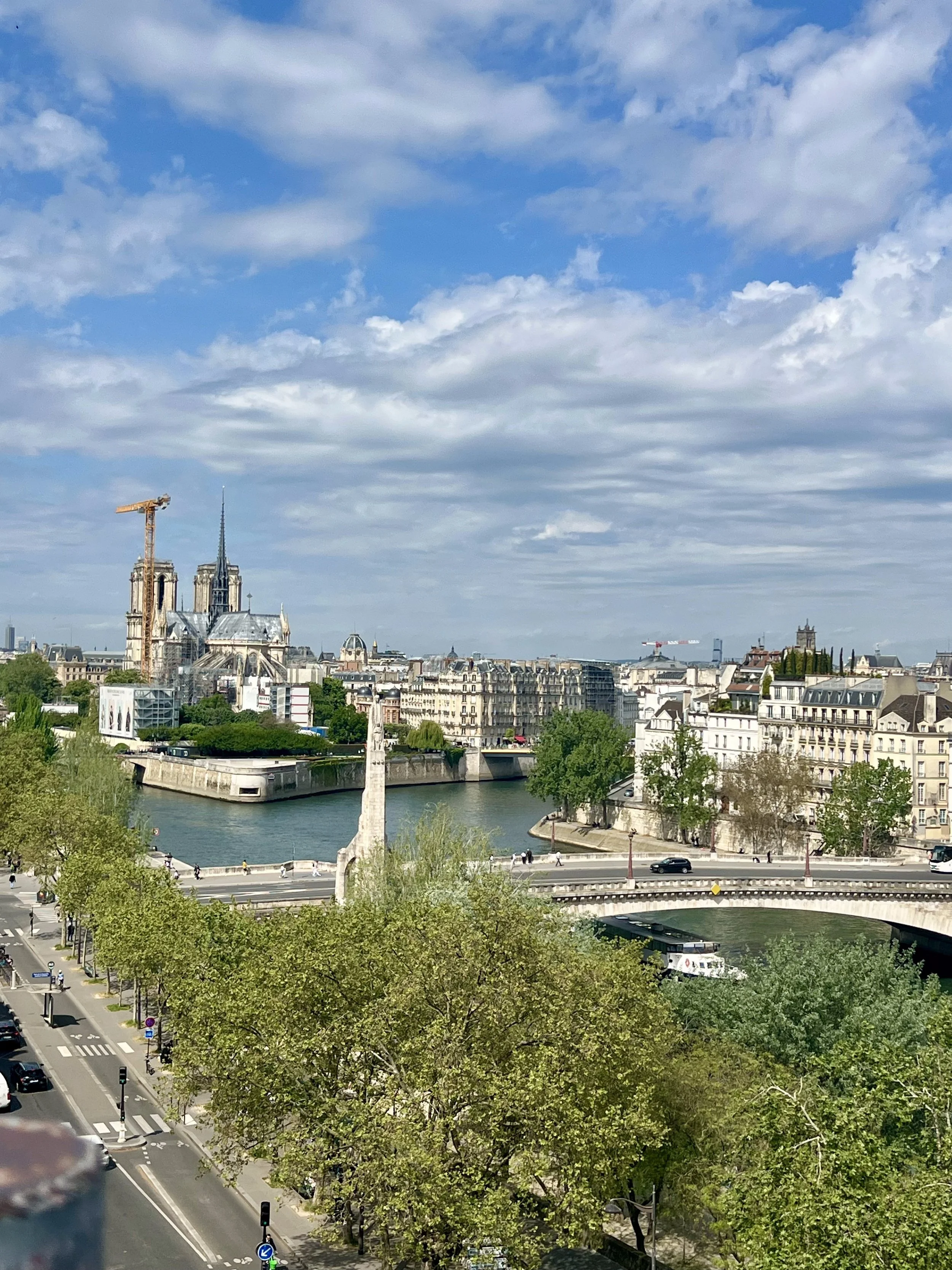 The Pont de la Tournelle over the River Seine and Notre Dame being reconstructed in the background in Paris, France. April 2026. 