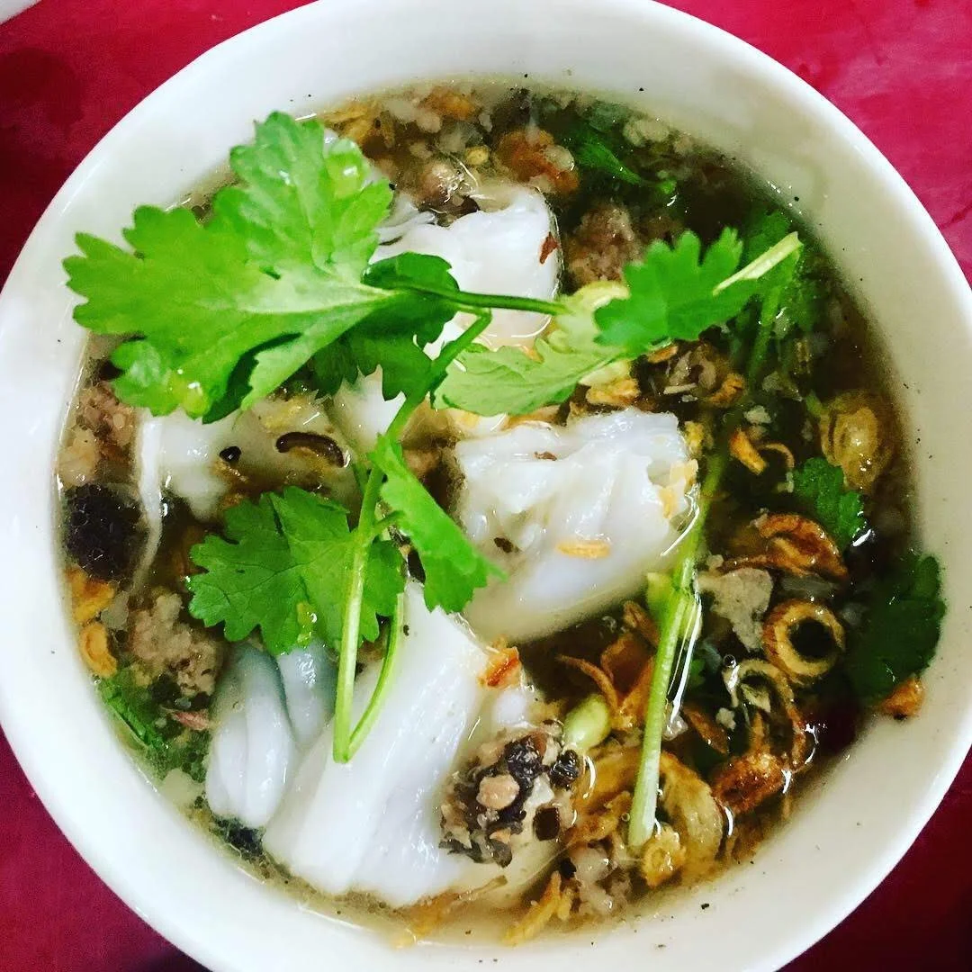 I think this is a version of banh cuon, but I'm not certain. I do remember that it was absolutely delicious and we devoured it on our first morning in Hanoi, Vietnam, after a long flight from Paris. January 2019. 