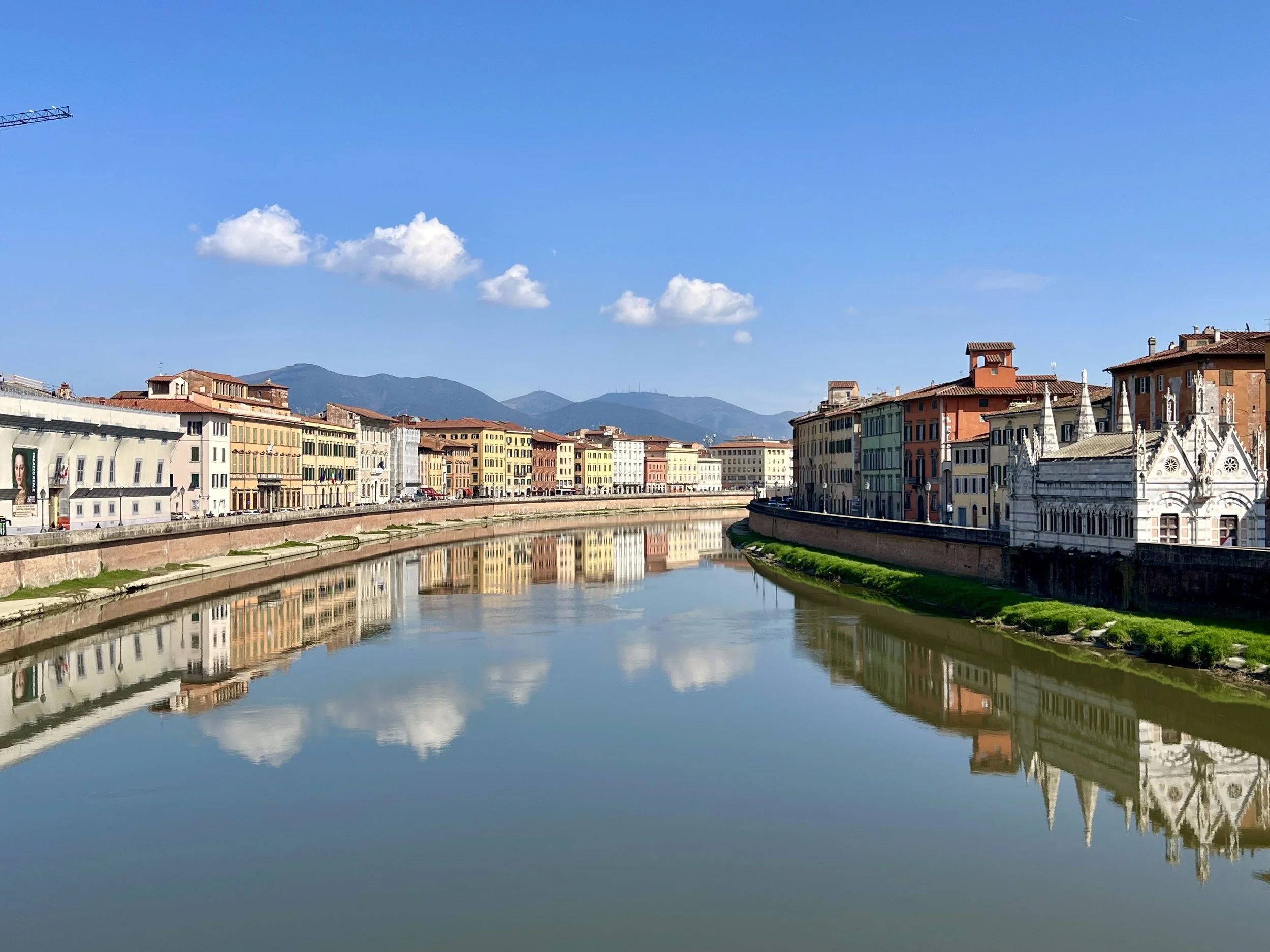 I love this shot of the city and sky reflected in the Arno River in Pisa, Italy. March 2026. 