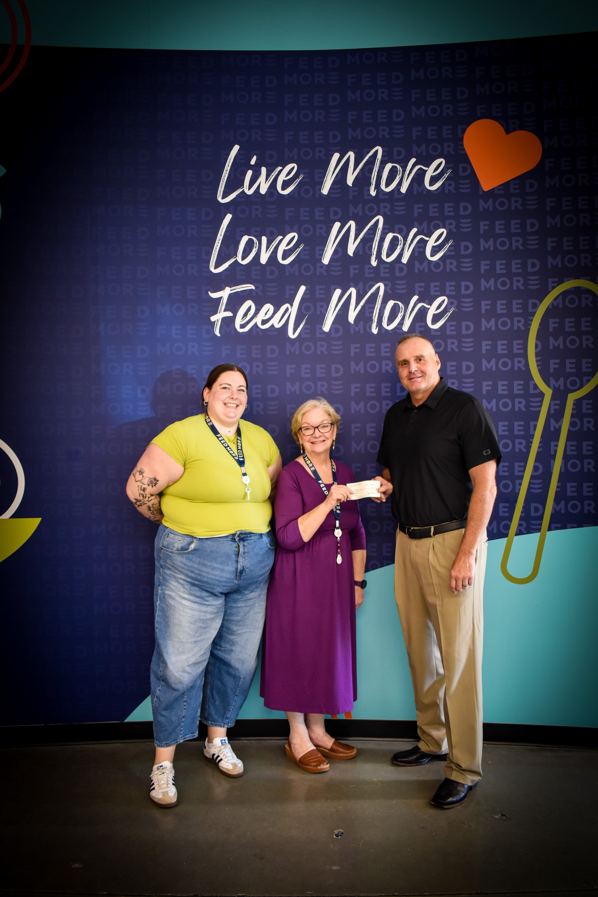 Chair, Bryan Doane delivers check to Feedmore