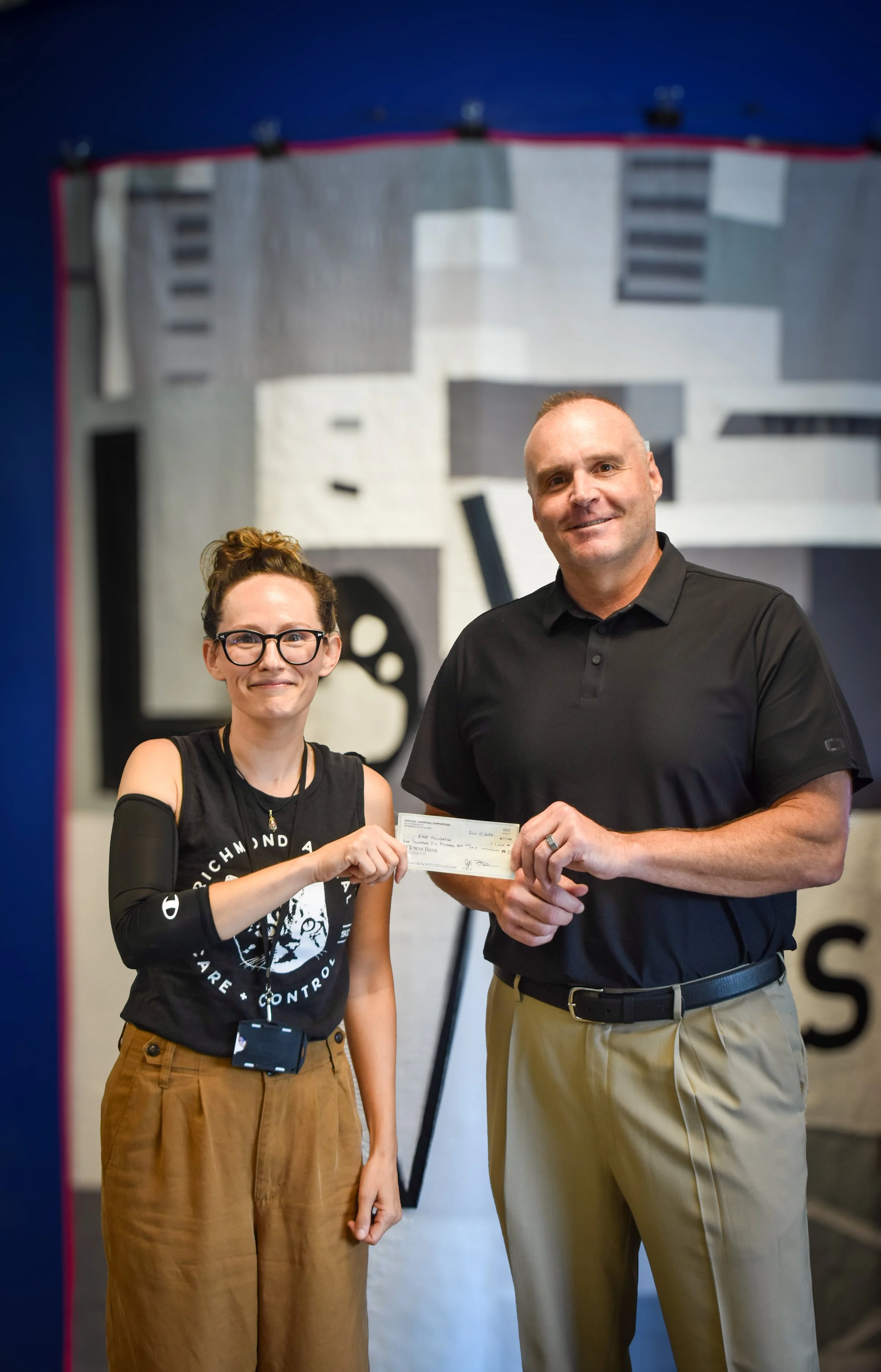 Chair,  Bryan Doane delivers check to RACC