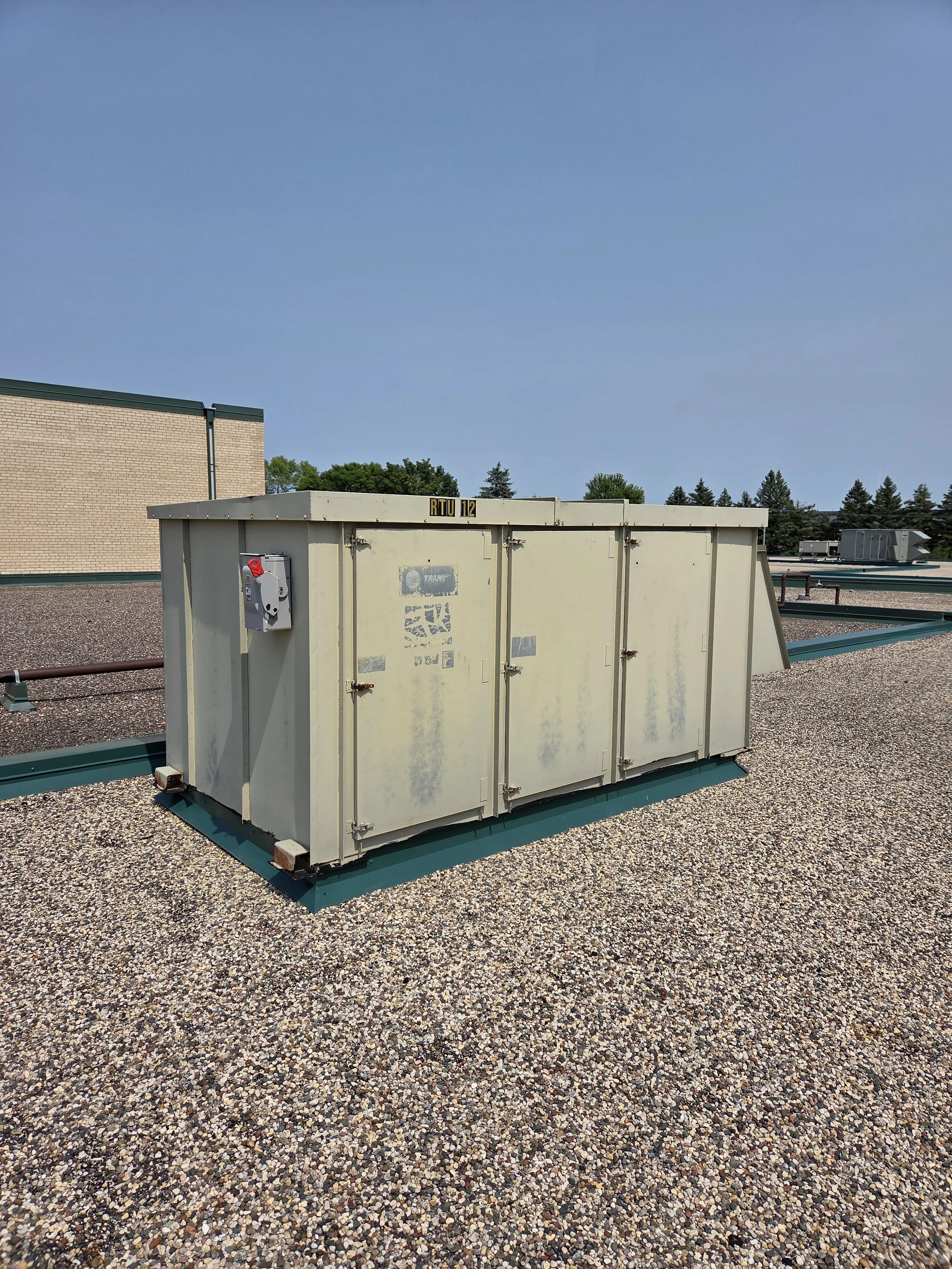 A photo showing an outdated roofing unit for the wrestling room at the Litchfield Middle/High School.