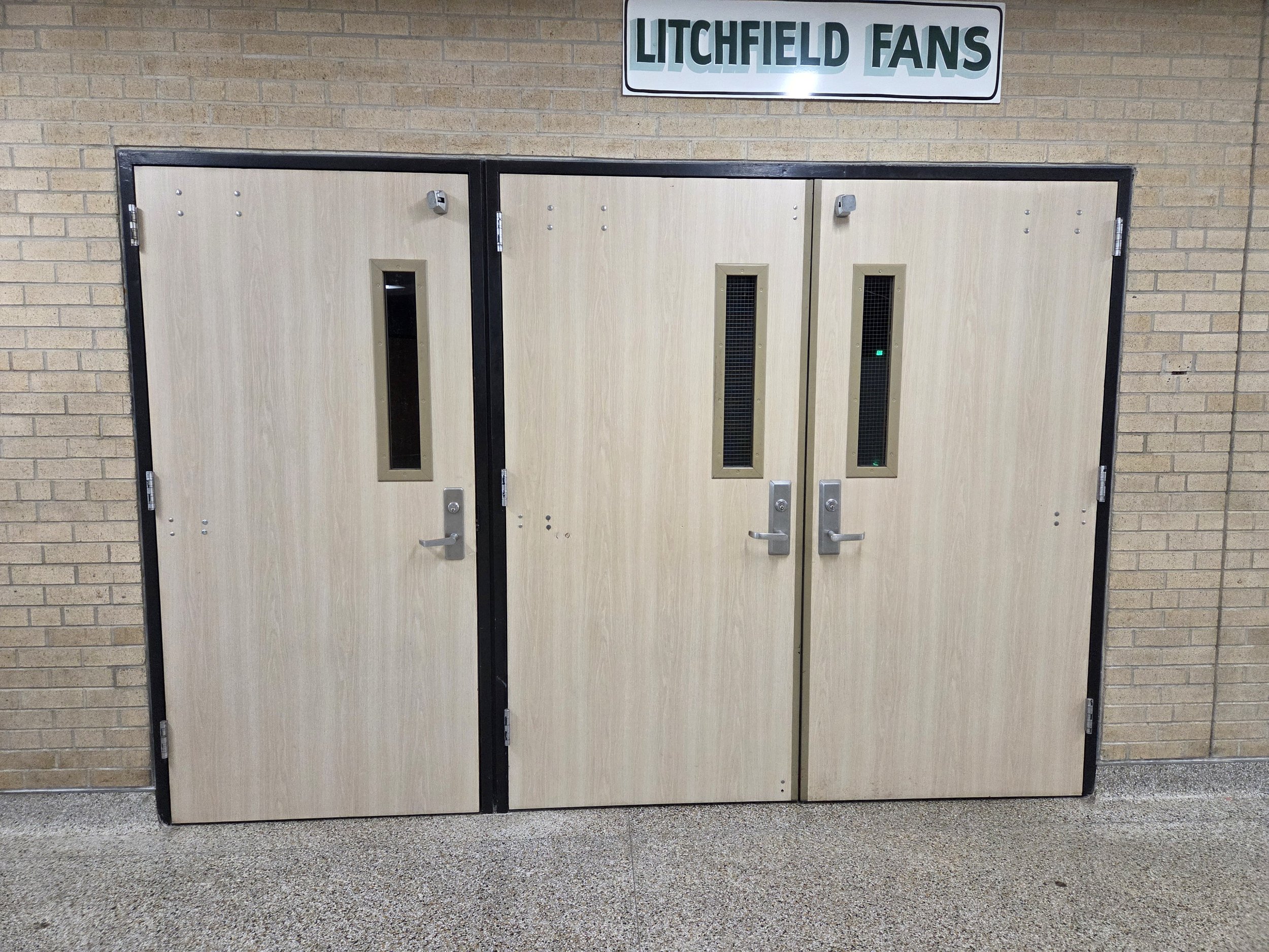 A photo showing the egress doors going into the gymnasium at Litchfield Middle/High School.