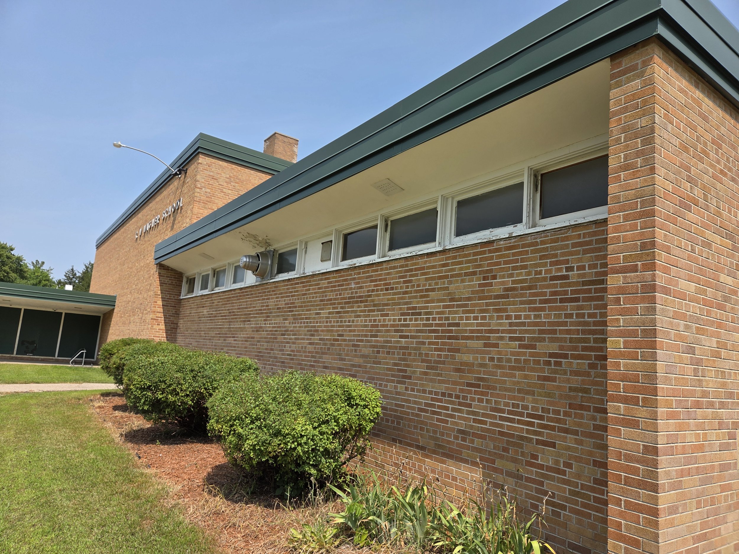 A photo showing the outdated wood windows at the Wagner Education Building.