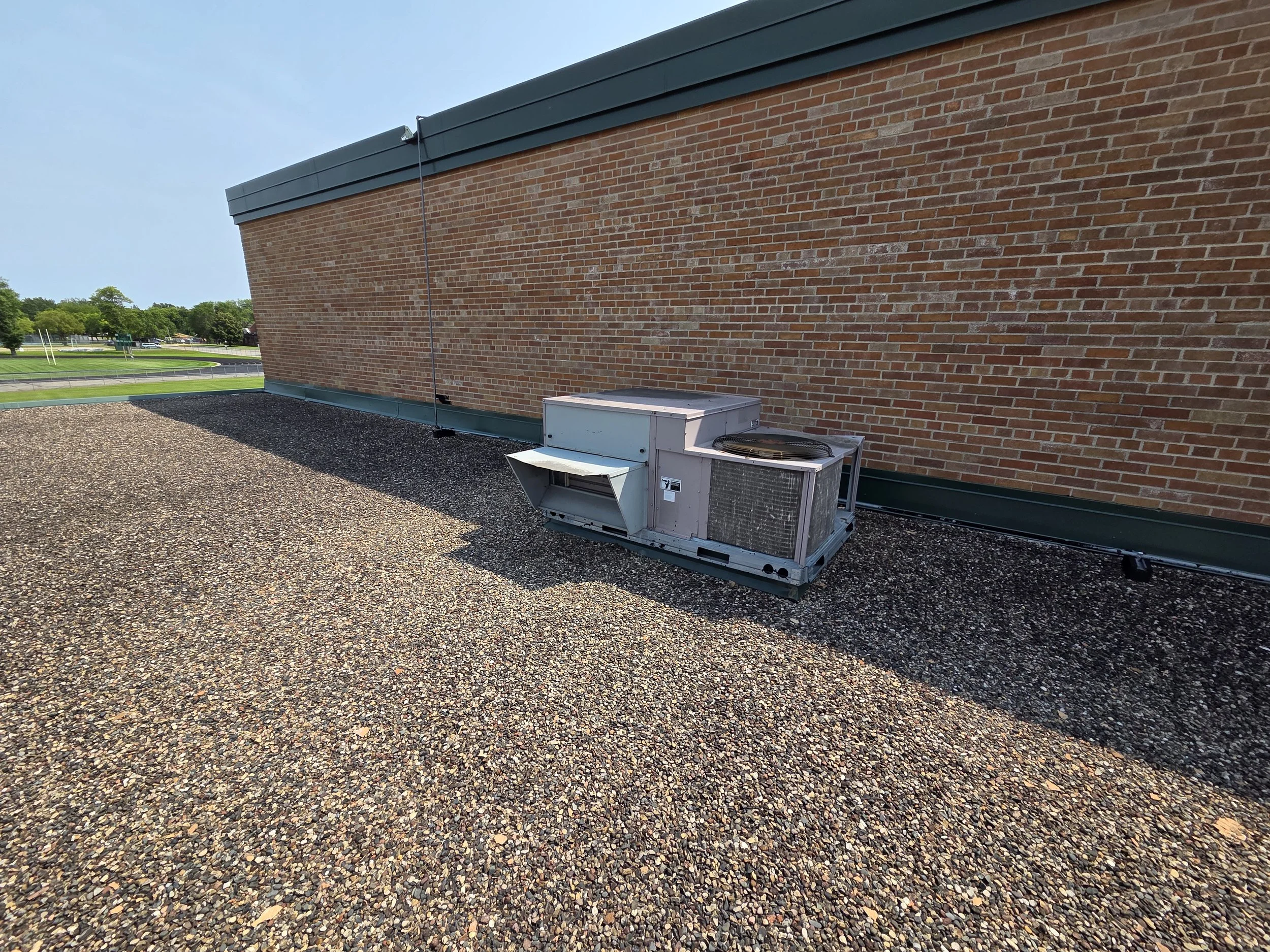 A photo showing an outdated rooftop unit at the Wagner Education Building.