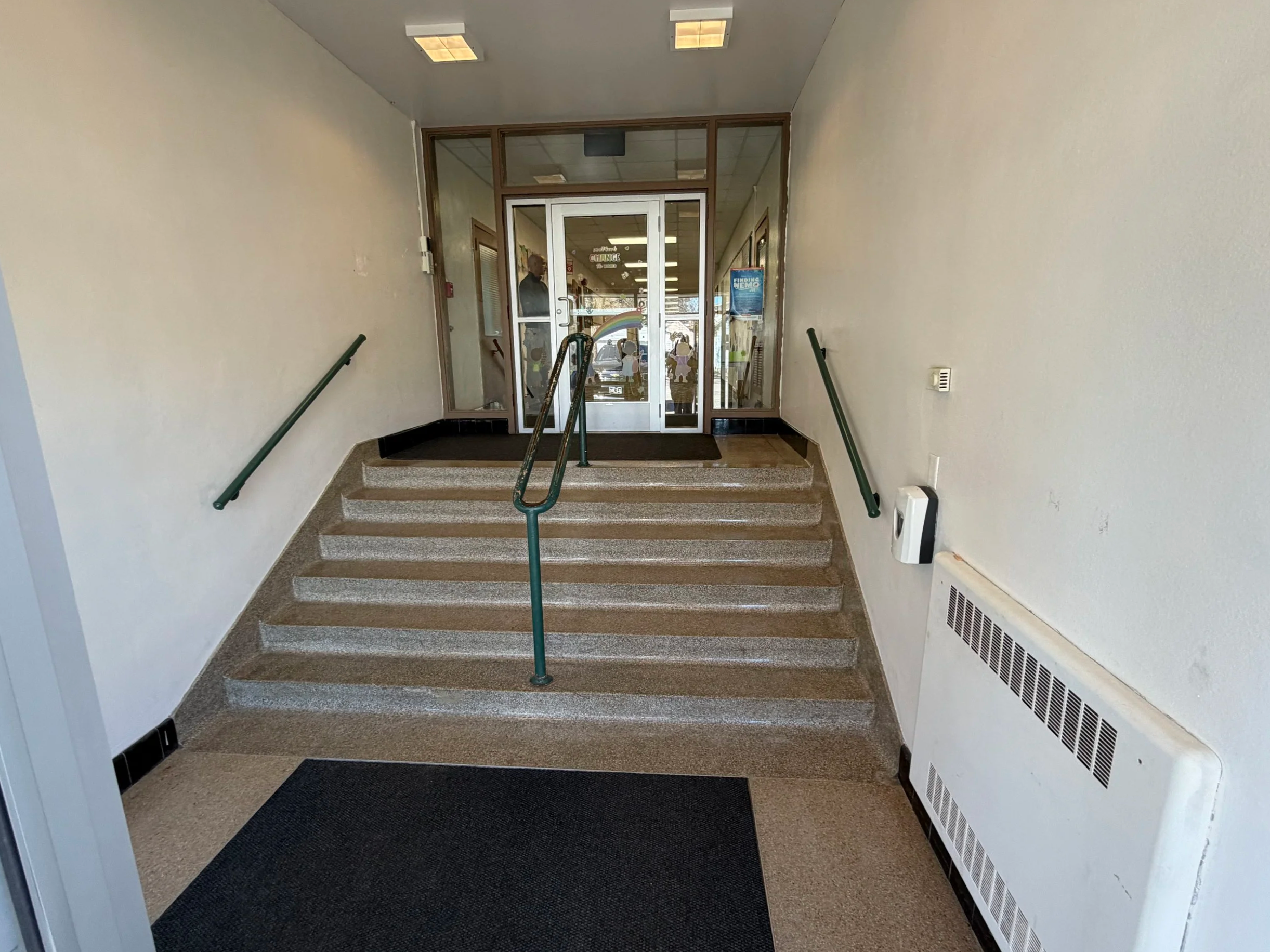 Indoor staircase at the Wagner Education Building, noting the lack of ADA accessibility.