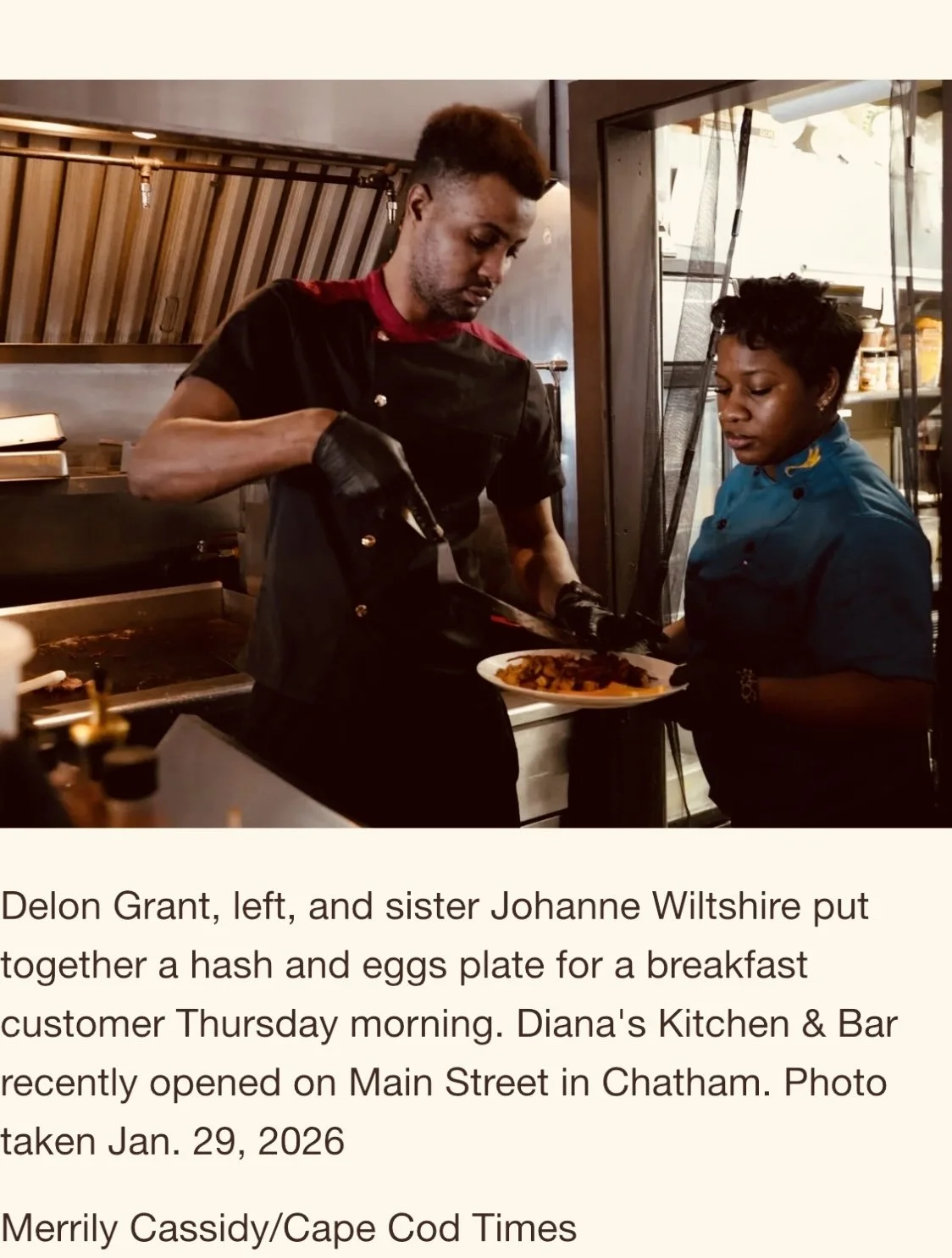 Two female chefs, Delon Grant on the left and sister Johanne Wiltshire on the right, preparing a breakfast dish in a restaurant kitchen.