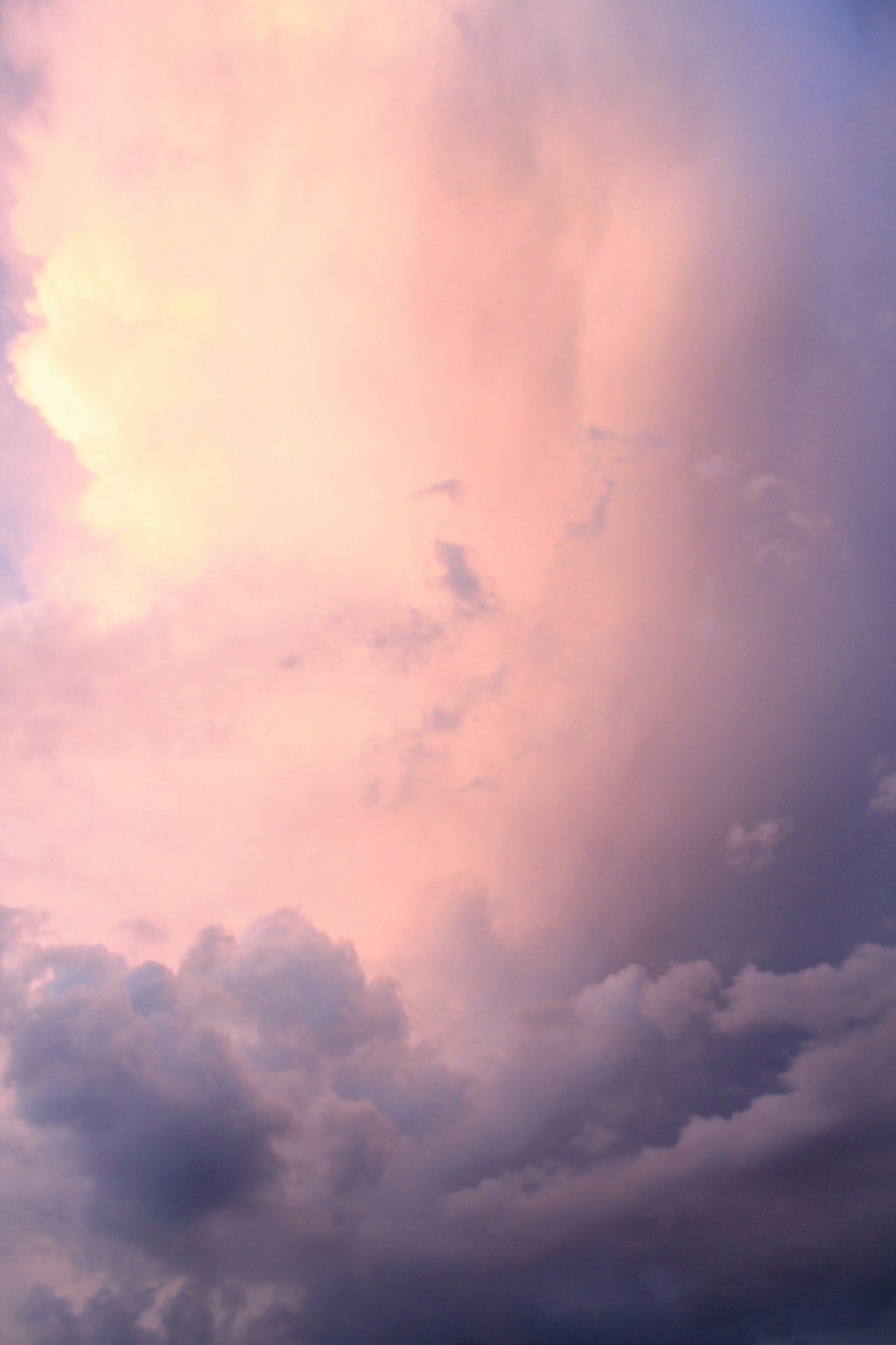 Colorful sky with pink, purple, and blue clouds at sunset or sunrise.
