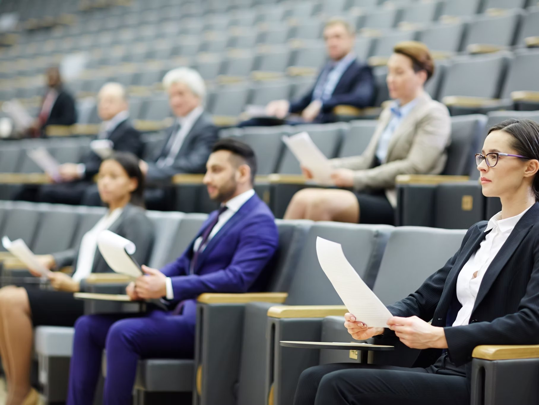 Business professionals engaged in a conference
