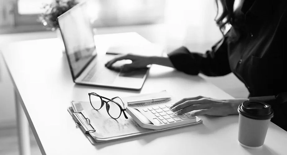 Businesswoman reviewing accounting and financial data on her computer.
