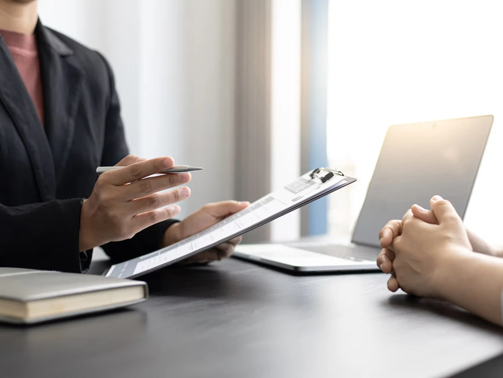 Business professional conducting an interview at a workplace.