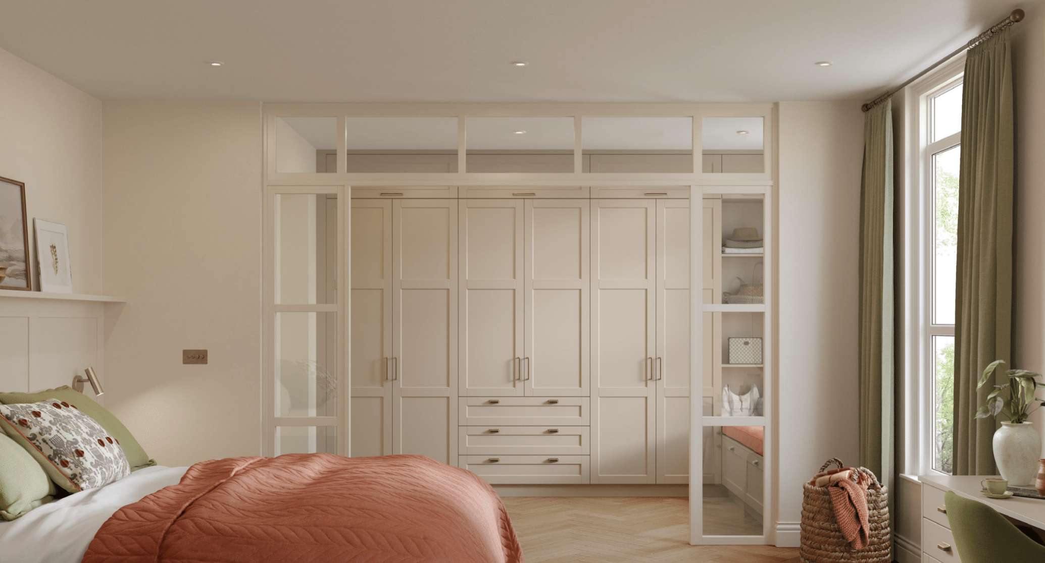 A bedroom with a bed, decorative pillows, and a built-in wardrobe with glass-paneled doors, adjacent to a window with green curtains and a plant in a white vase.