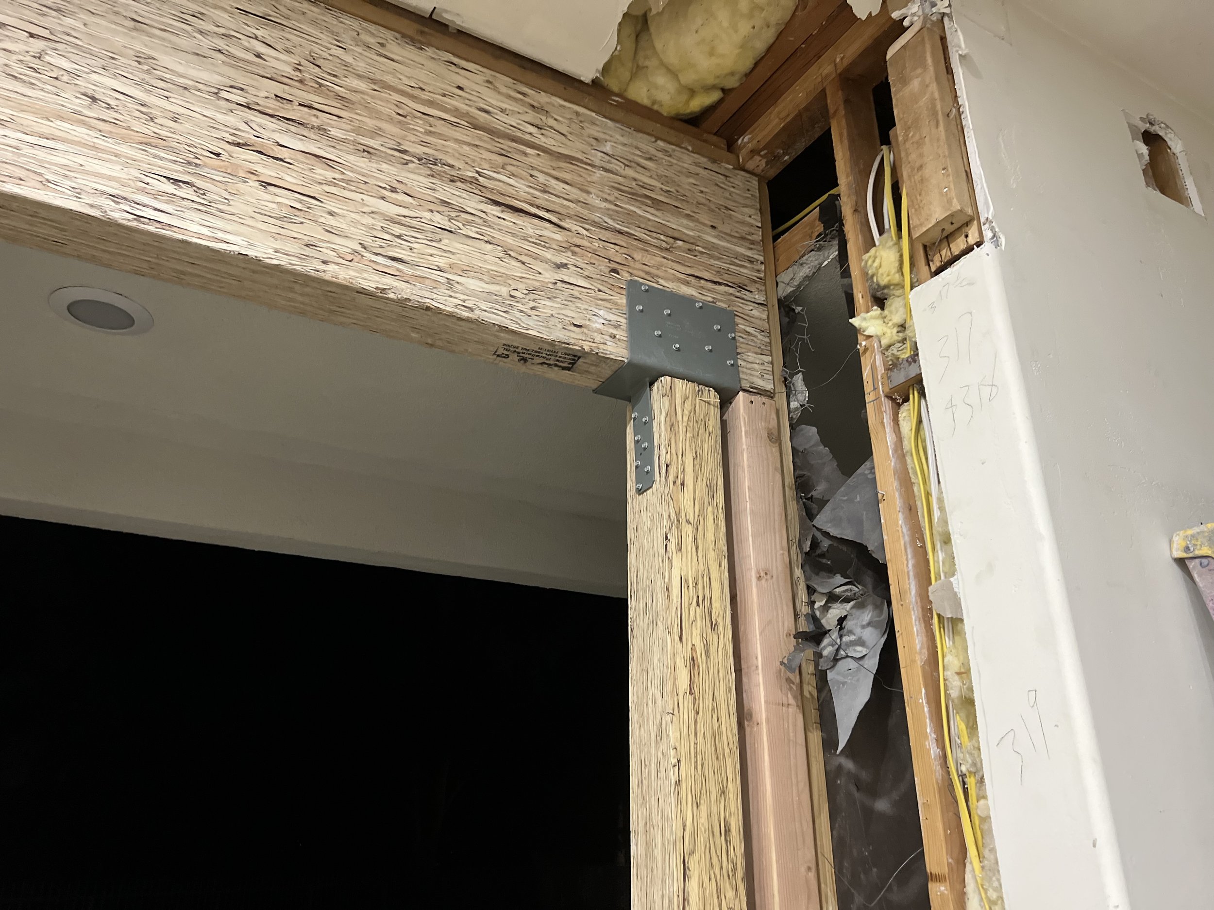 “This picture illustrates how the engineered wood beam, along with structural posts and brackets, was properly finished and secured to meet engineering specifications.”