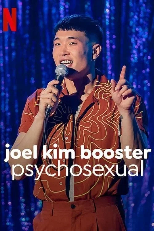 A man wearing a patterned shirt and holding a microphone, standing in front of a glittery purple curtain, with Netflix logo and text overlay reading "joel kim booster psychosexual".