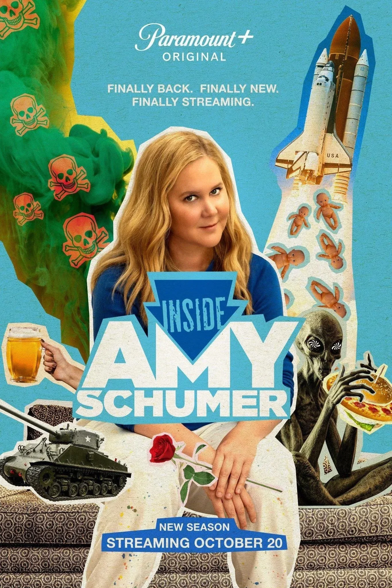 A promotional poster for the show 'Inside Amy Schumer' featuring Amy Schumer holding a beer mug, with a tank, a skeleton, a spacecraft, a rocket, and other surreal images in the background. Text highlights the streaming availability and the new seaso