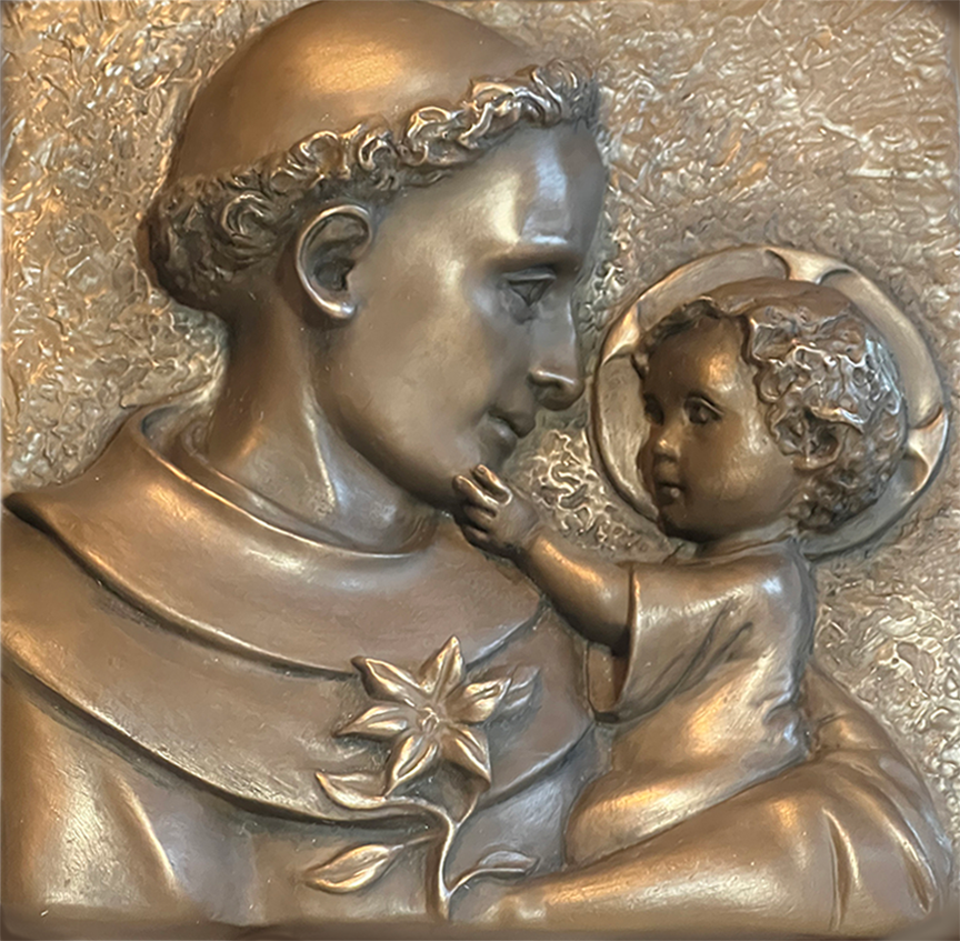 St. Anthony & the Child Jesus bronze bas relief.png