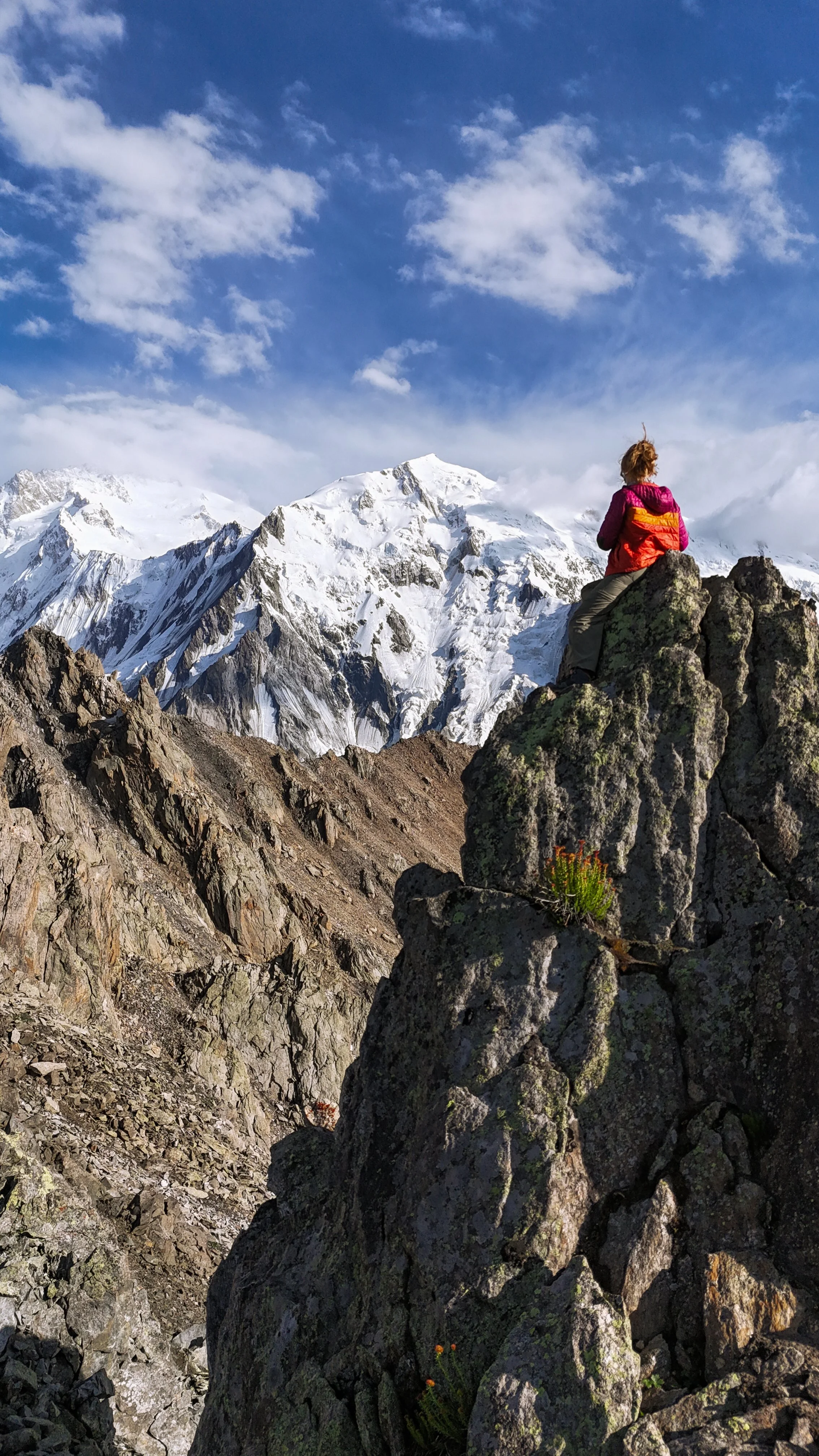 *drone photo* Catherine sits at the 6000~ meter summit of Jillipur Pass, looking up at Nanga Parbat