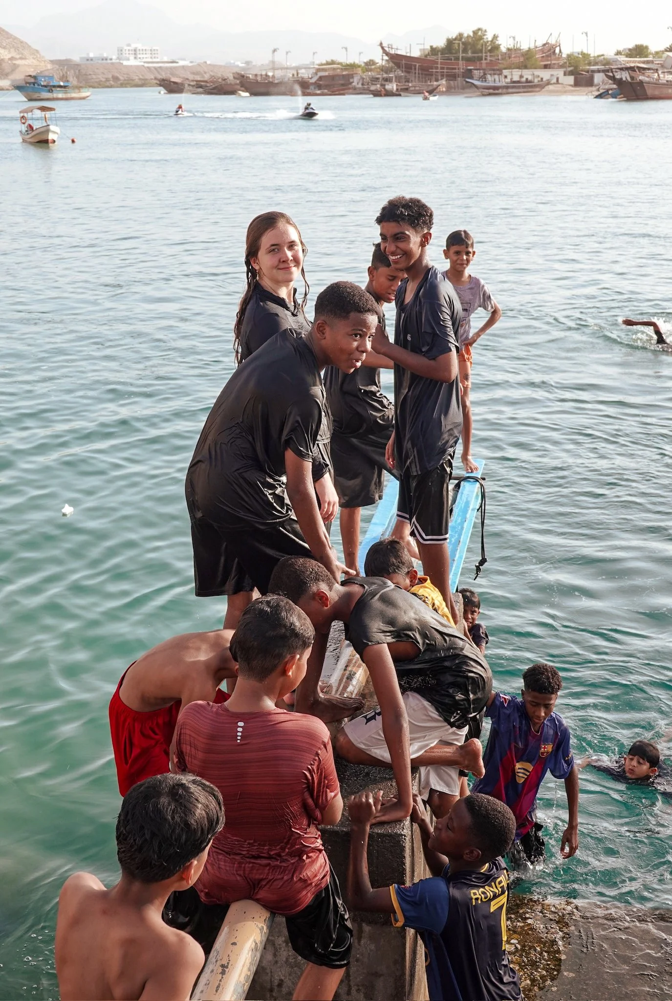 Anastasia swimming with local Omani boys