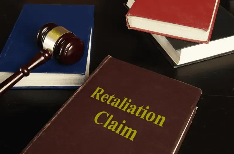 Collection of retaliation reference books laid out on a table