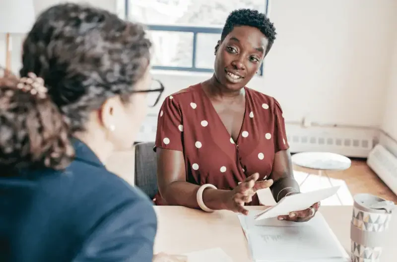 HR professional interviewing a job applicant during a recruitment meeting.