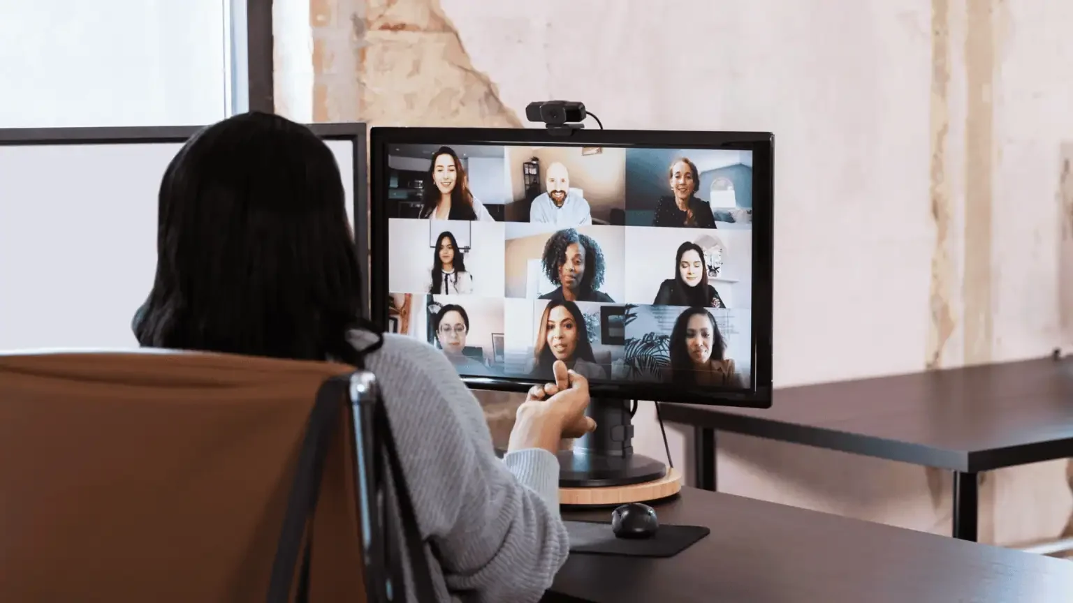 HR consultant meeting with a team during an online conference