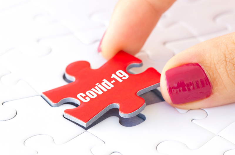 Puzzle piece featuring the words 'COVID-19'.