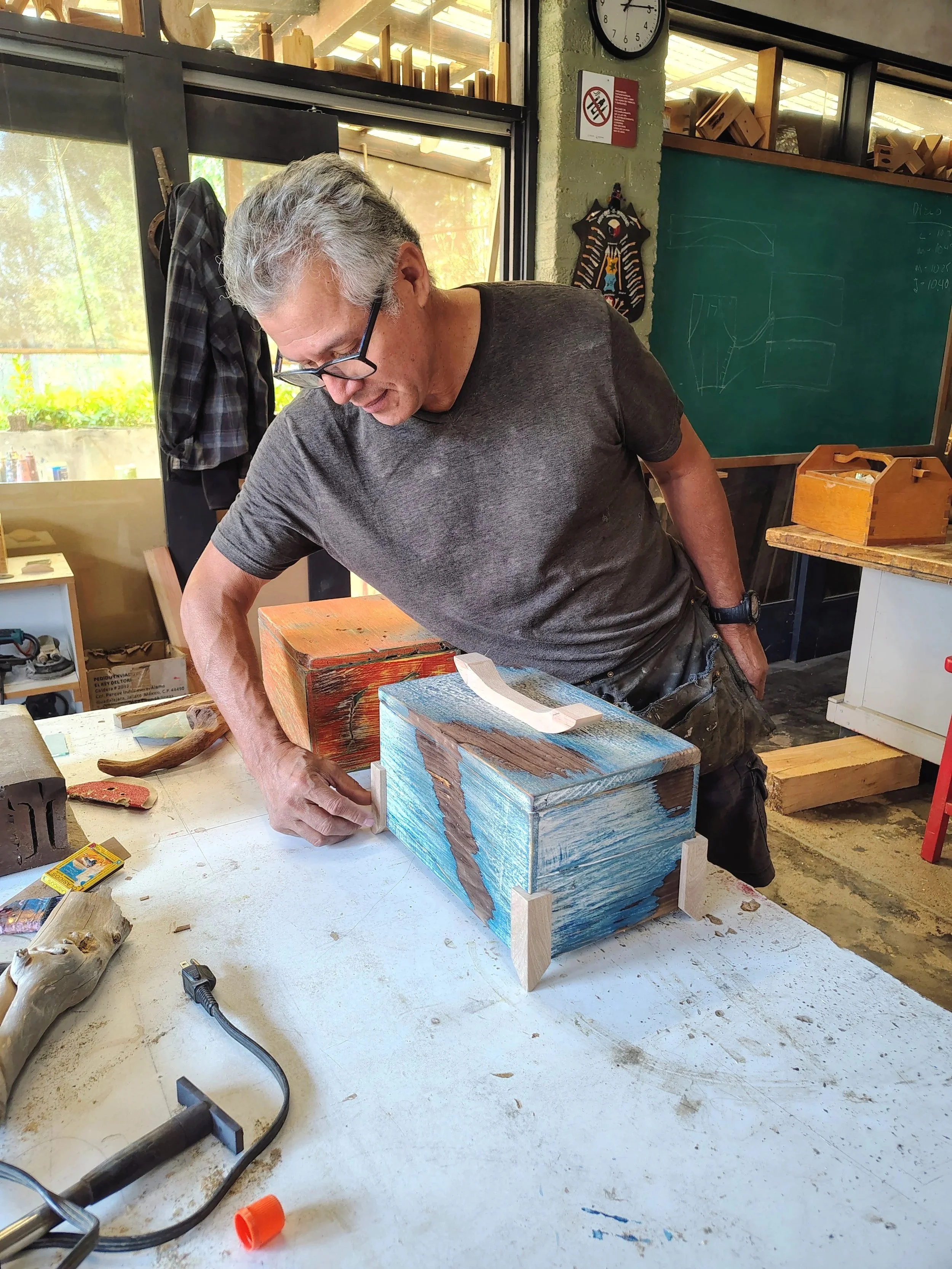 Gaspar Téllez demonstrating woodworking techniques in the Gaspart Studio workshop, providing hands-on instruction and personalized guidance to students.