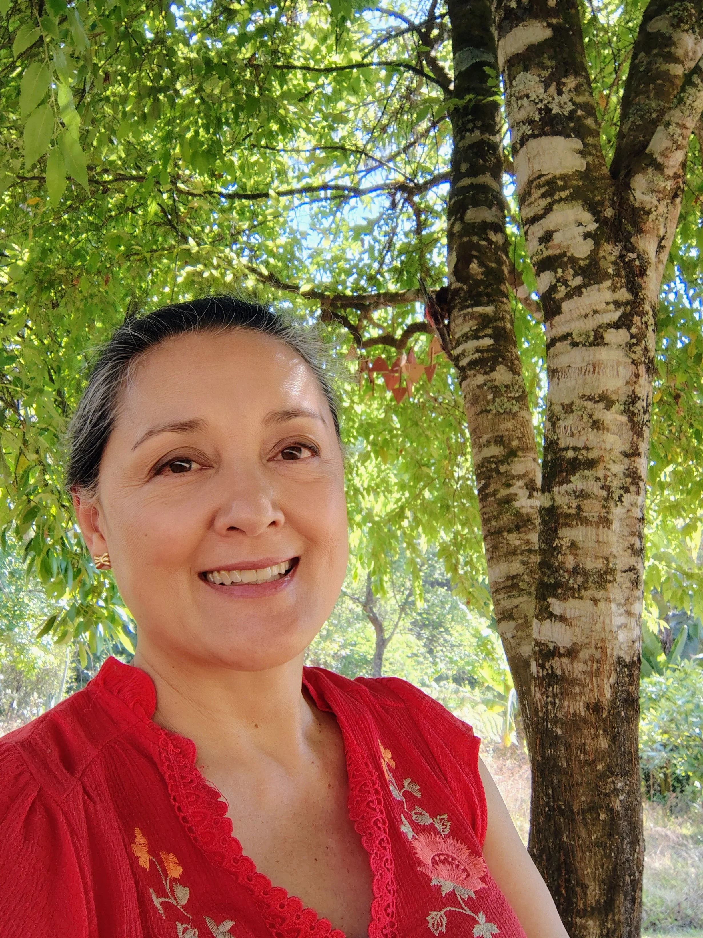 Fatimah Araneta smiling beneath the trees at El Rizal, where she teaches ceramics and builds a creative community.