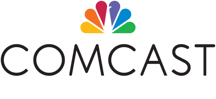 A colorful, stylized peacock icon in shades of red, orange, yellow, and blue, positioned above the word "COMCAST" in a black, modern sans-serif font.