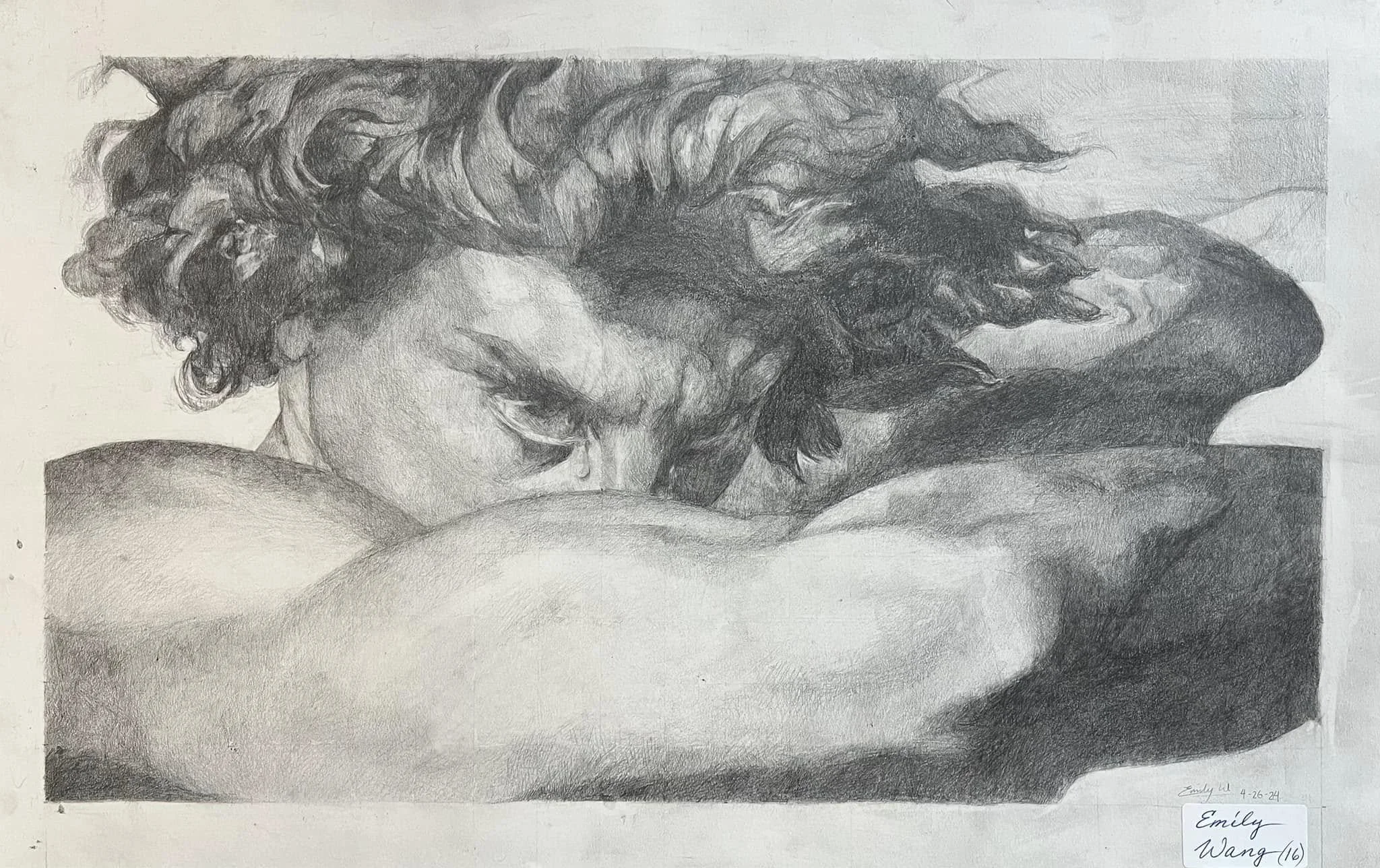 A detailed pencil sketch of a woman with curly hair resting her head on her arms. The drawing is shaded to create depth and realism, signed at the bottom right with the name 'Emily Wang' and the date '4-26-21'.